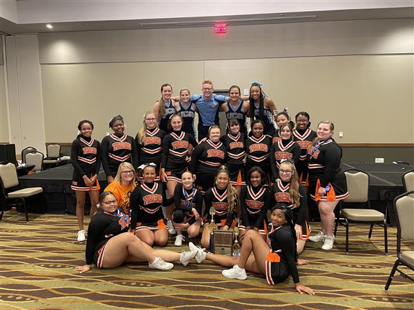 group of cheerleaders in black uniforms