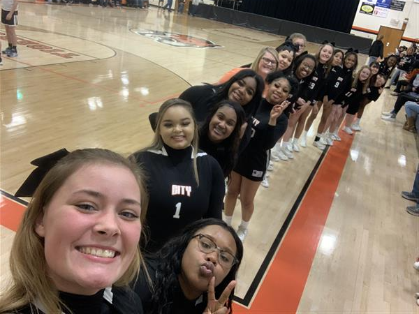 selfie of row of cheerleaders on sideline