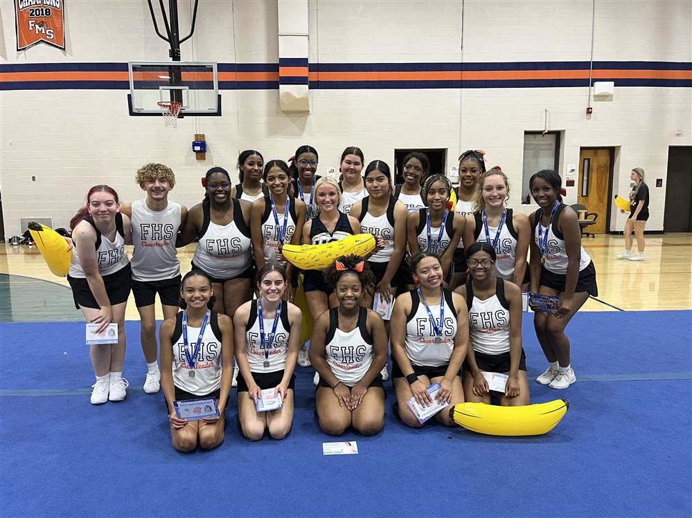 group of cheerleaders in gym 