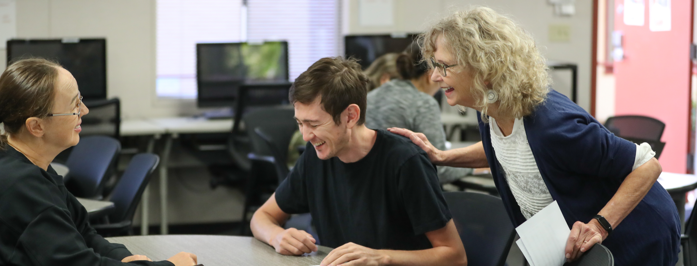 students laughing with teacher