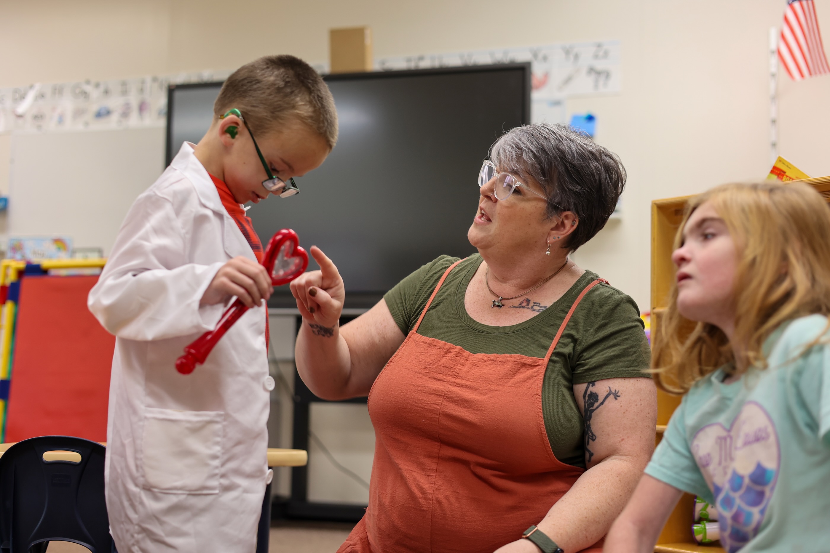 Teacher working with student