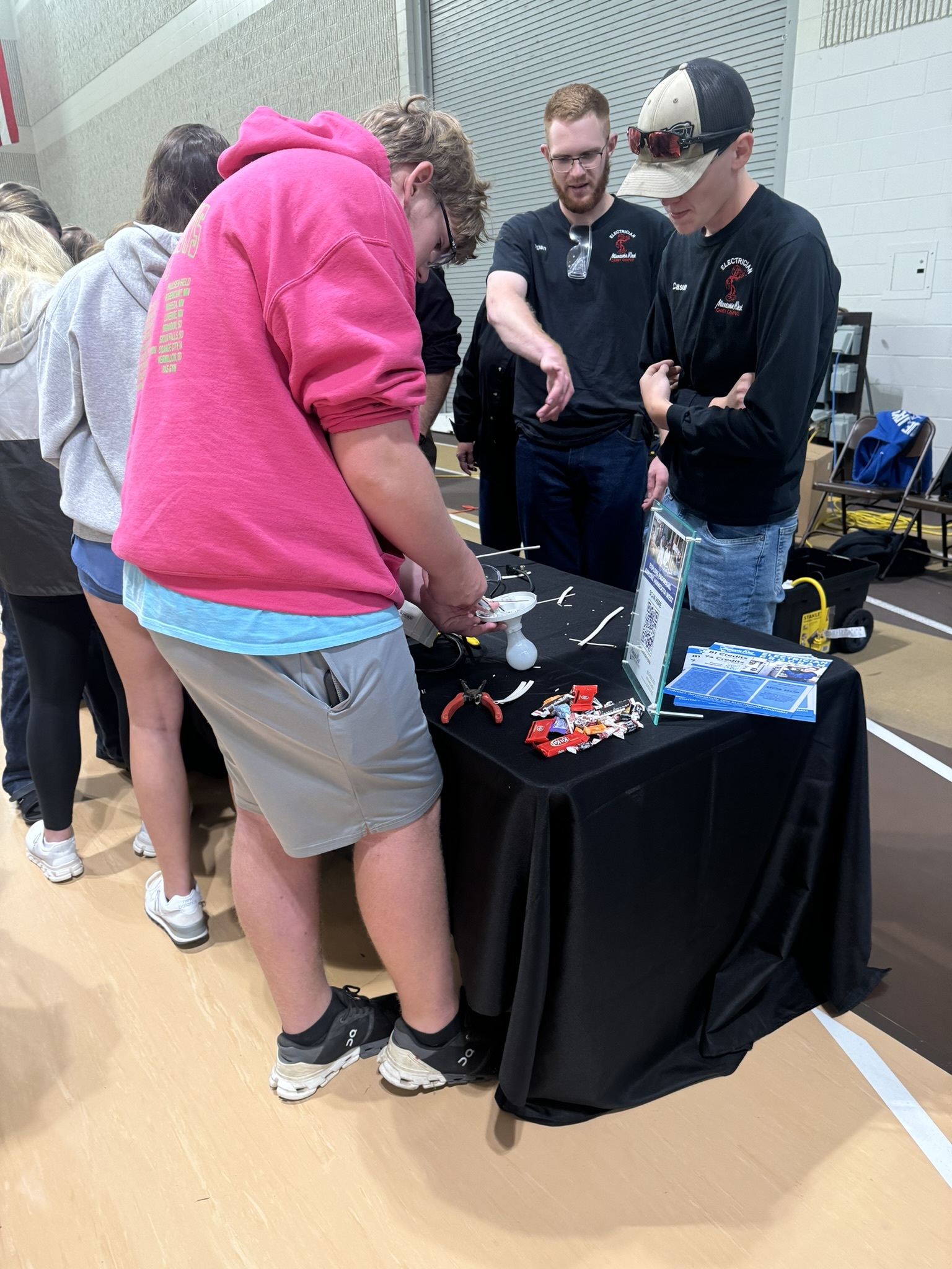 students at exhibitor booth