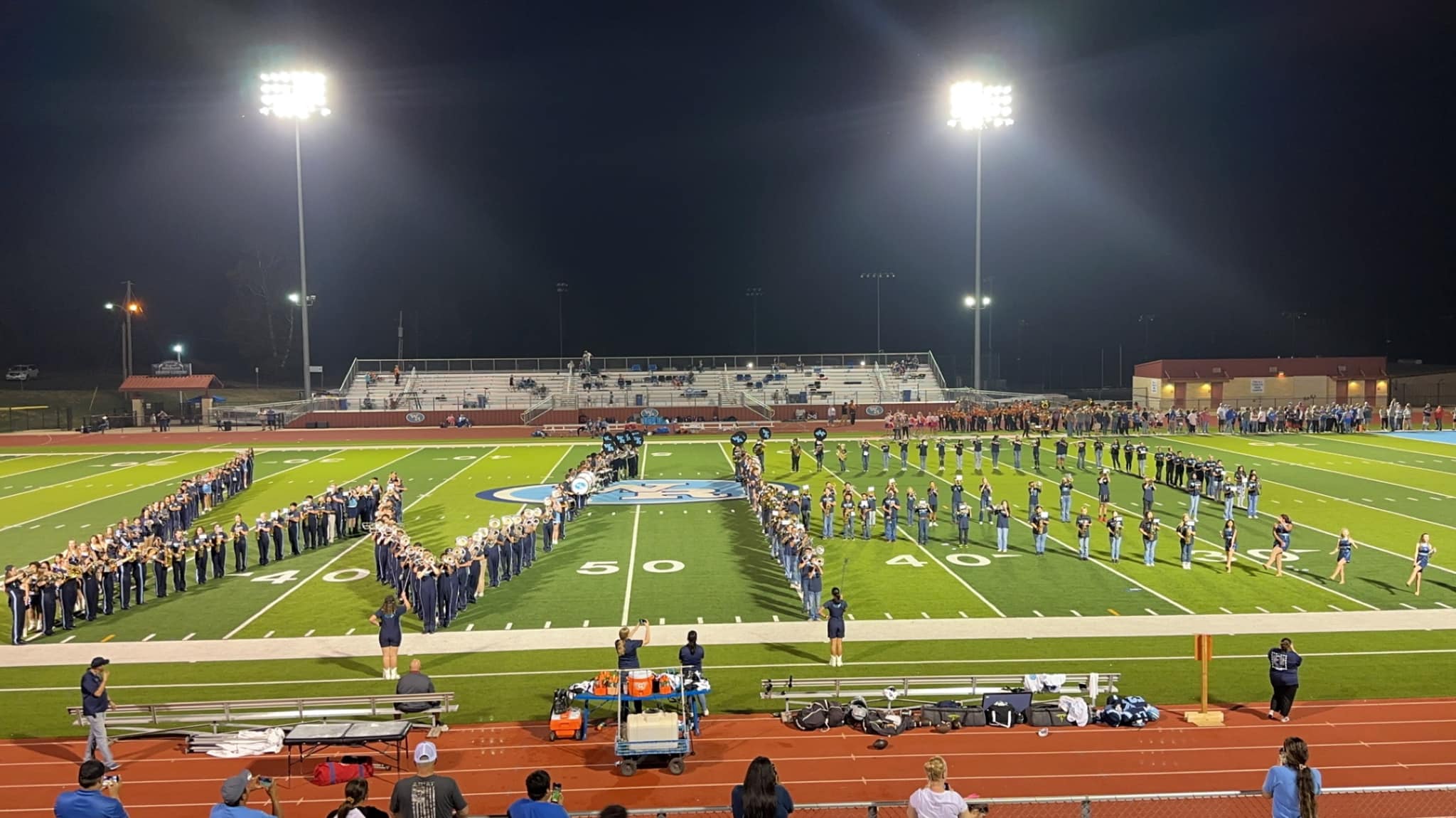 West Rusk Junior High and West Rusk High School band students form a WR on the football field