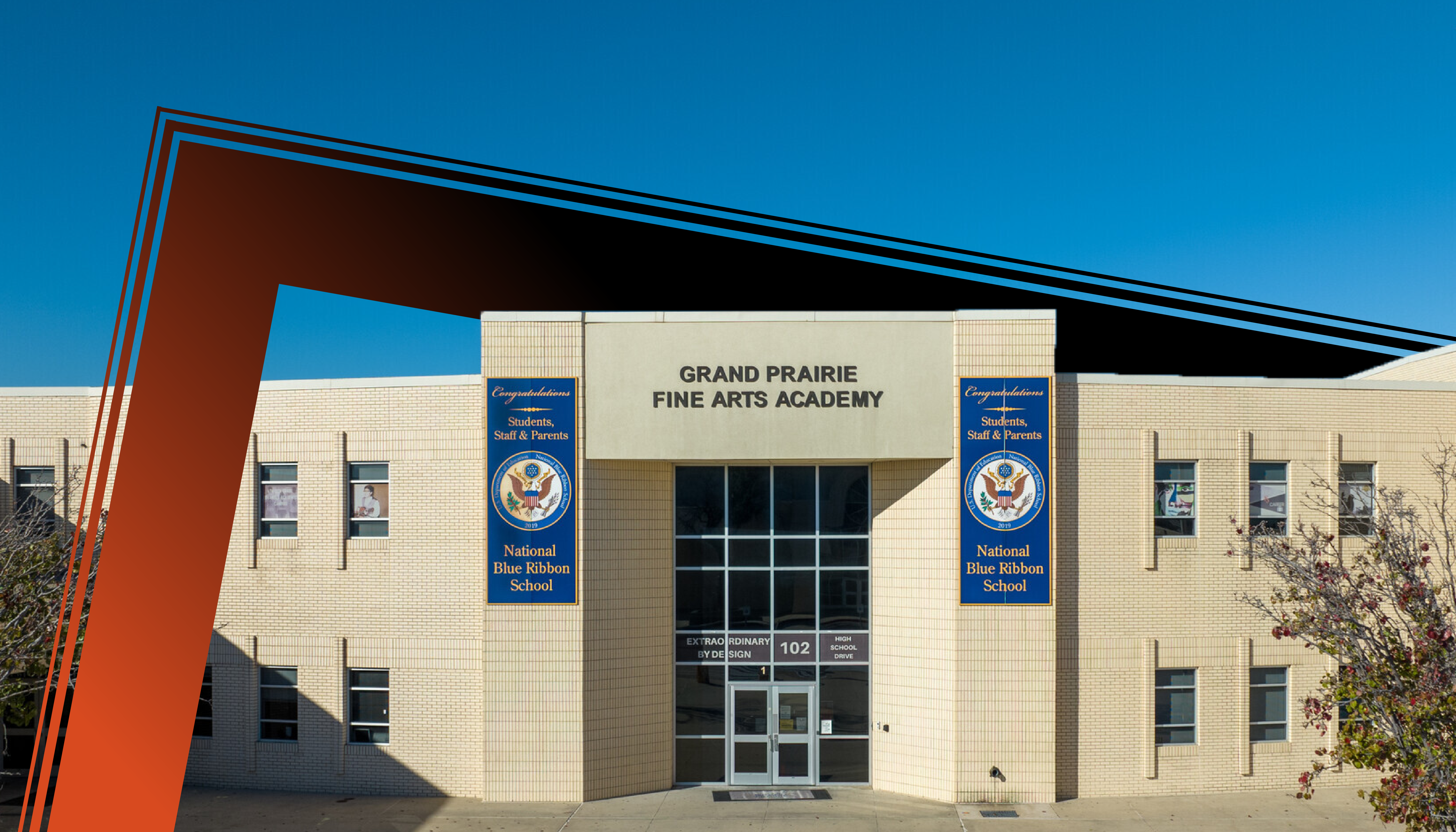 A modern, multi-story building with a prominent entrance and signage for the "Grand Prairie Fine Arts Academy" against a clear blue sky.