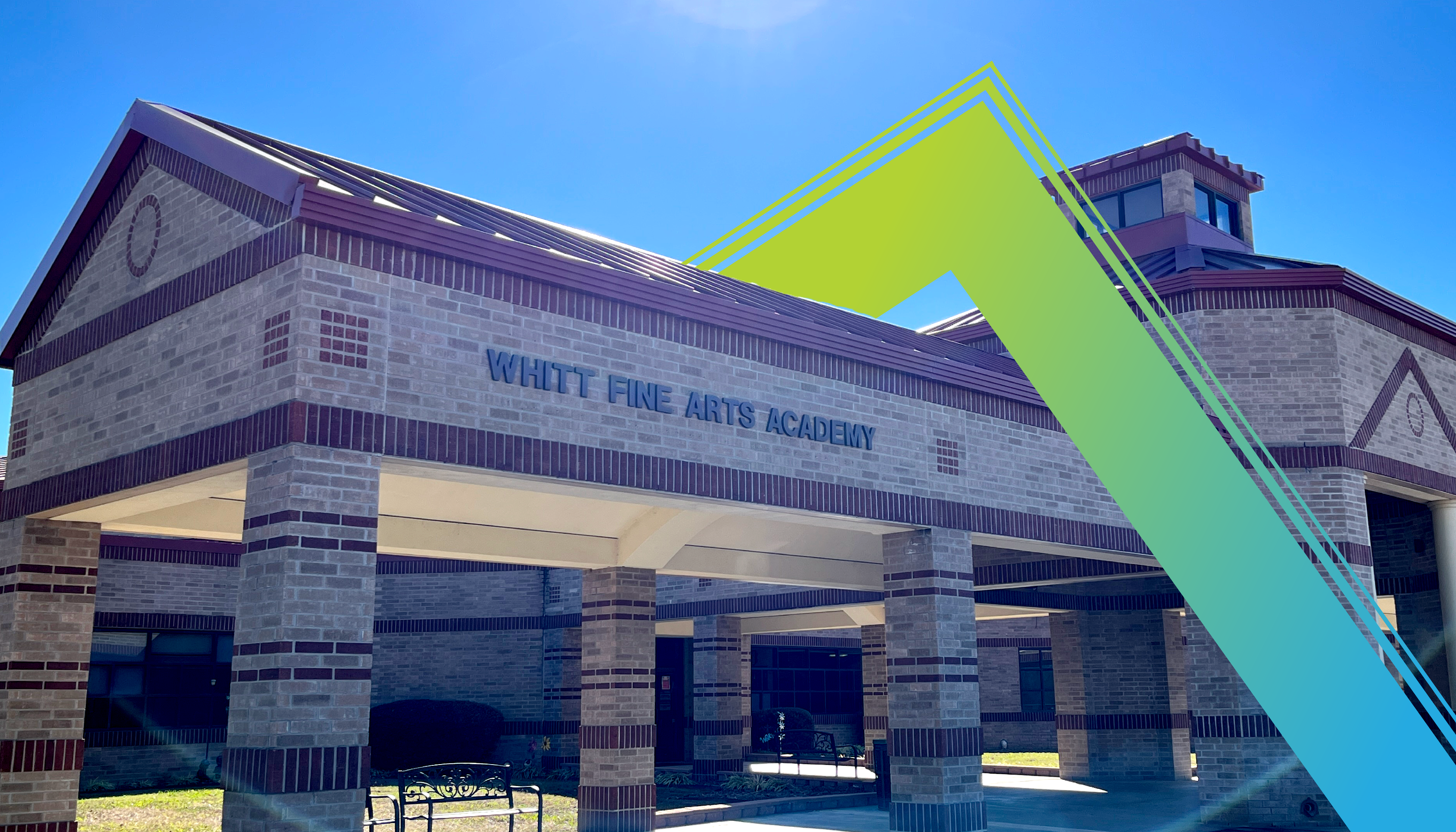 A large brick building with the words "White Pine Arts Academy" prominently displayed, set against a bright blue sky with a vibrant yellow and teal geometric shape in the foreground.