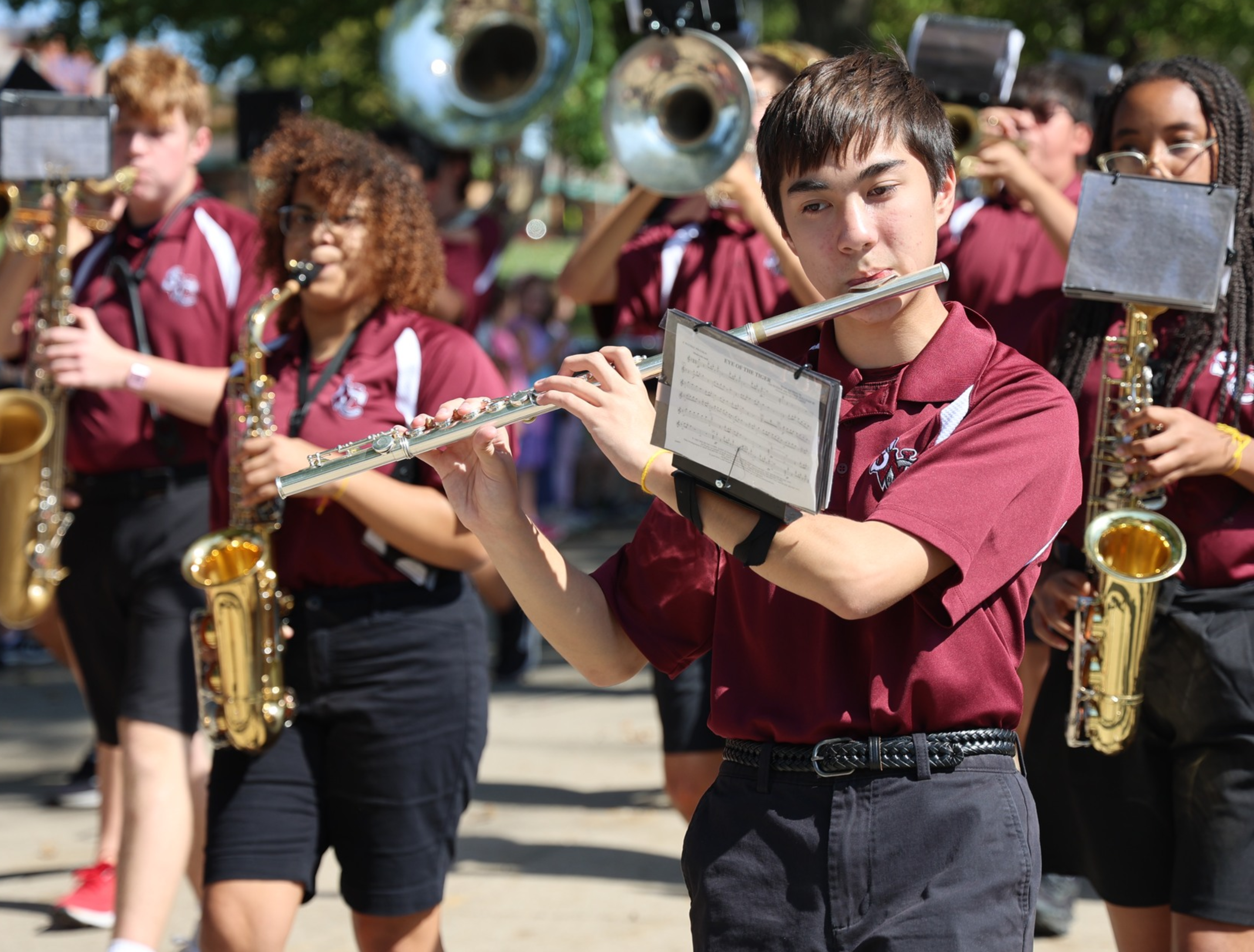 photo of marching band student playing flute