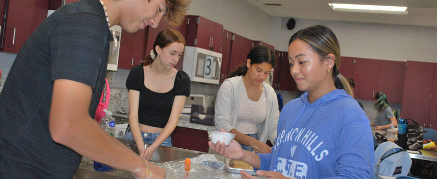 Students and teacher working in a foods class