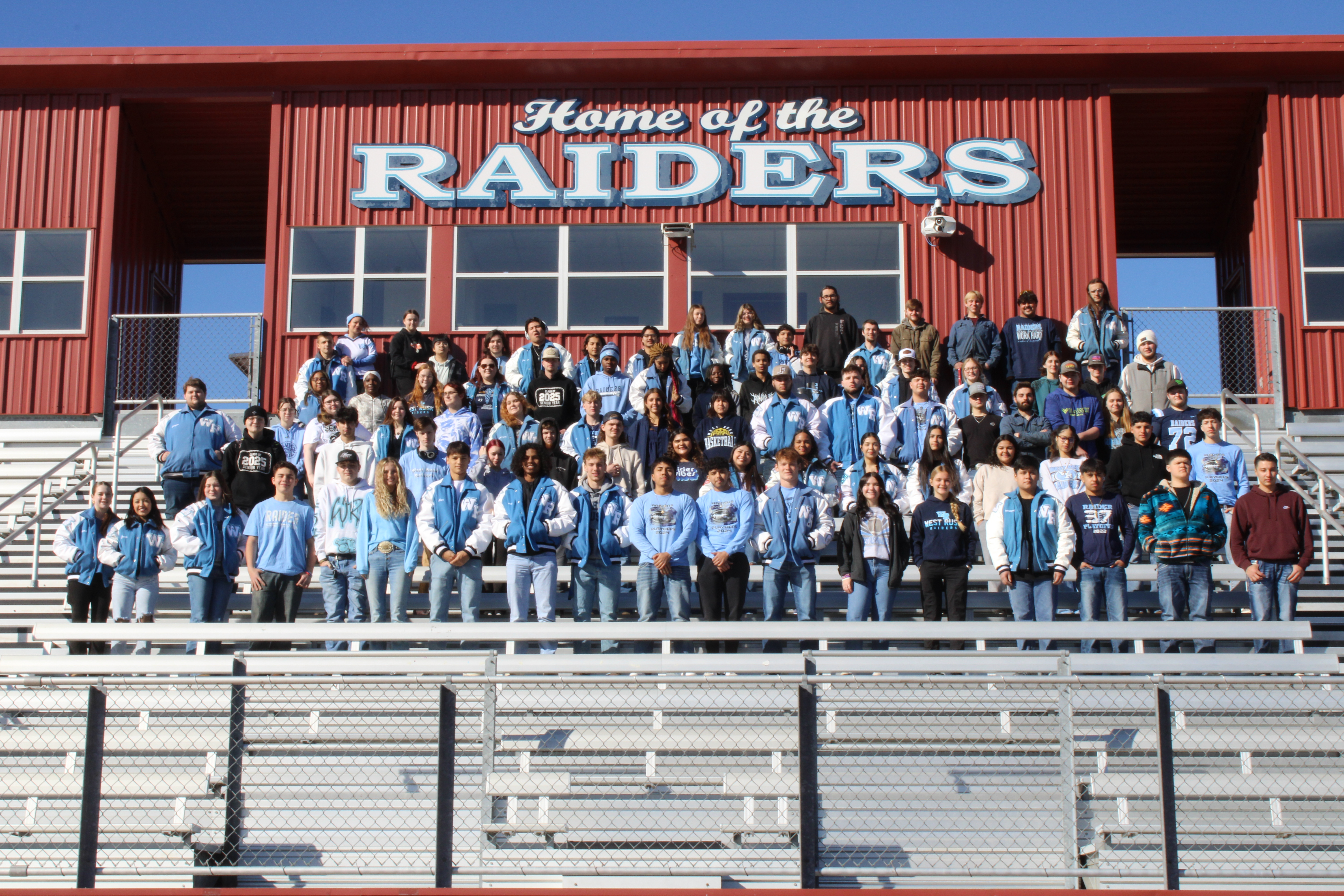 West Rusk High School Seniors standing on the bleachers of the stadium