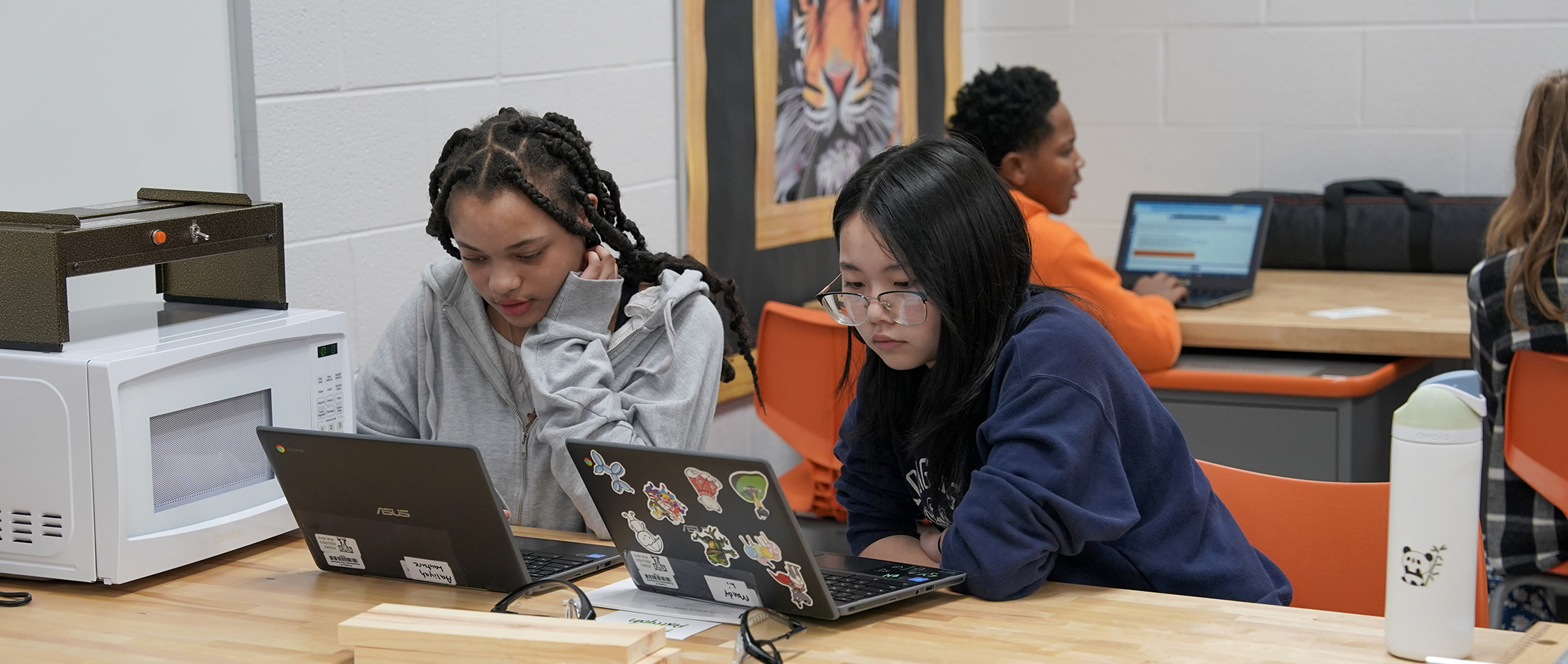 two students in FMS lab