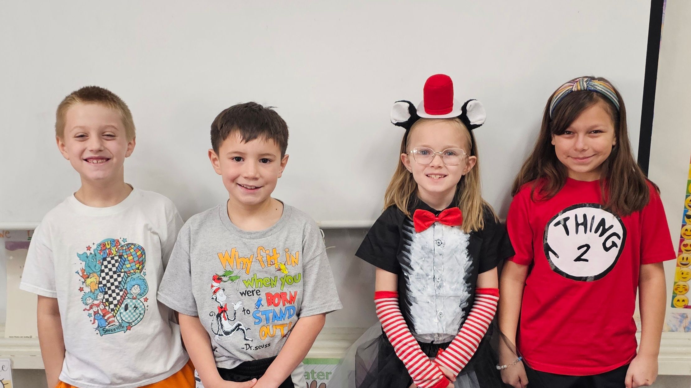 4 students in Dr. Seuss outfits
