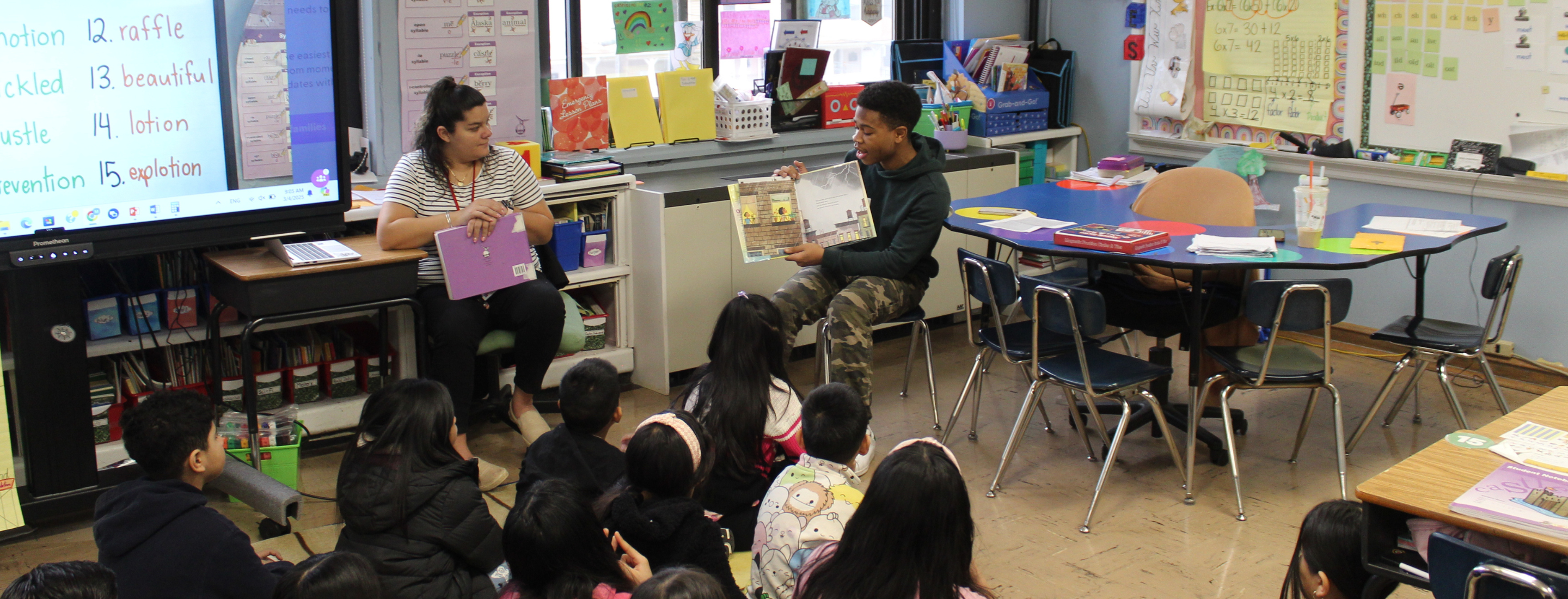 High school students reading to elementary students for read across America day