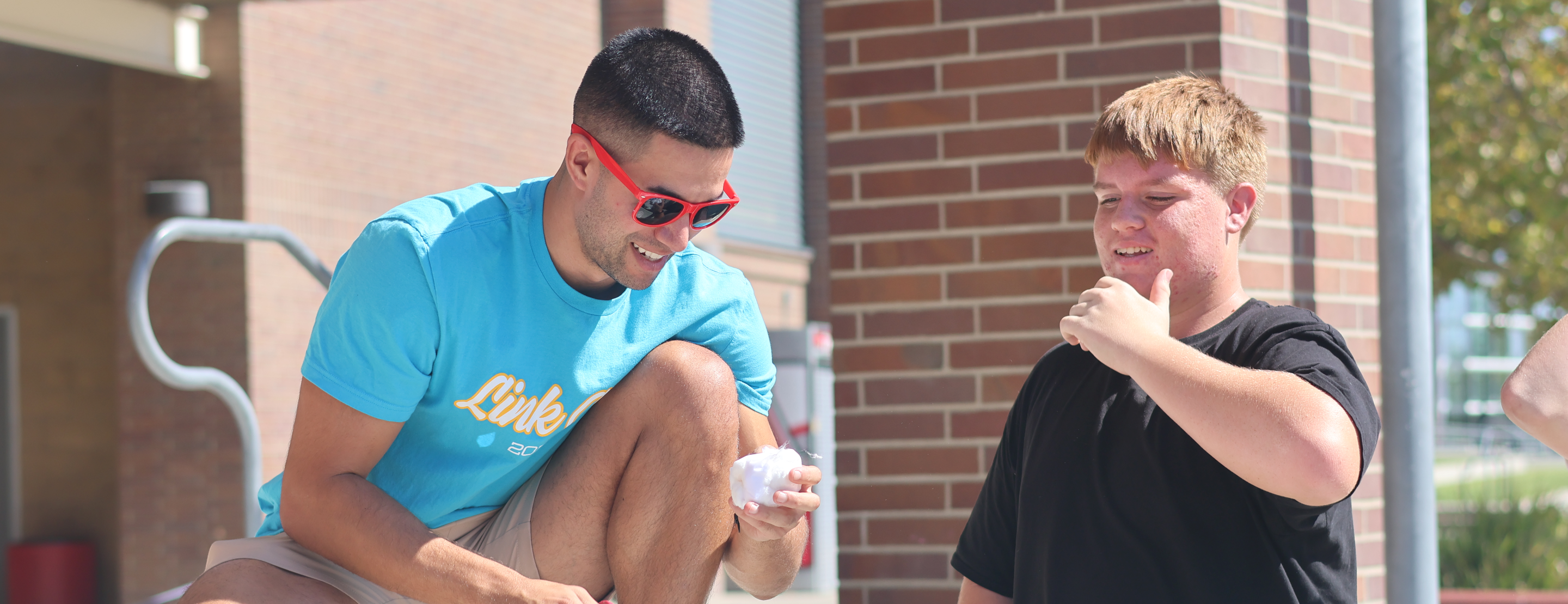 teacher showing a student an object