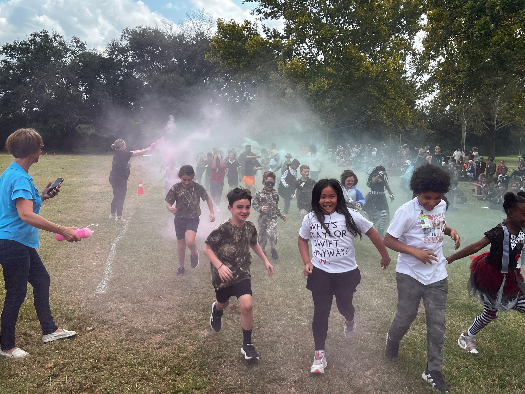 Students getting sprayed with colors during the monster run. 