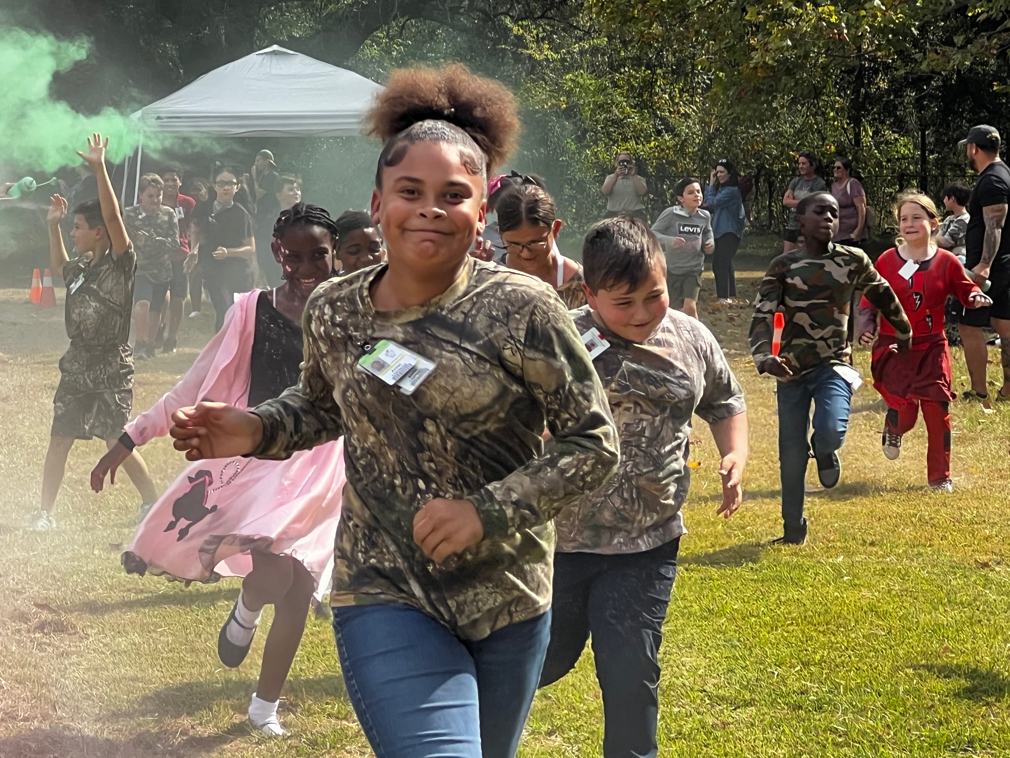 Girls and boys running through colors during the Monster Run. 