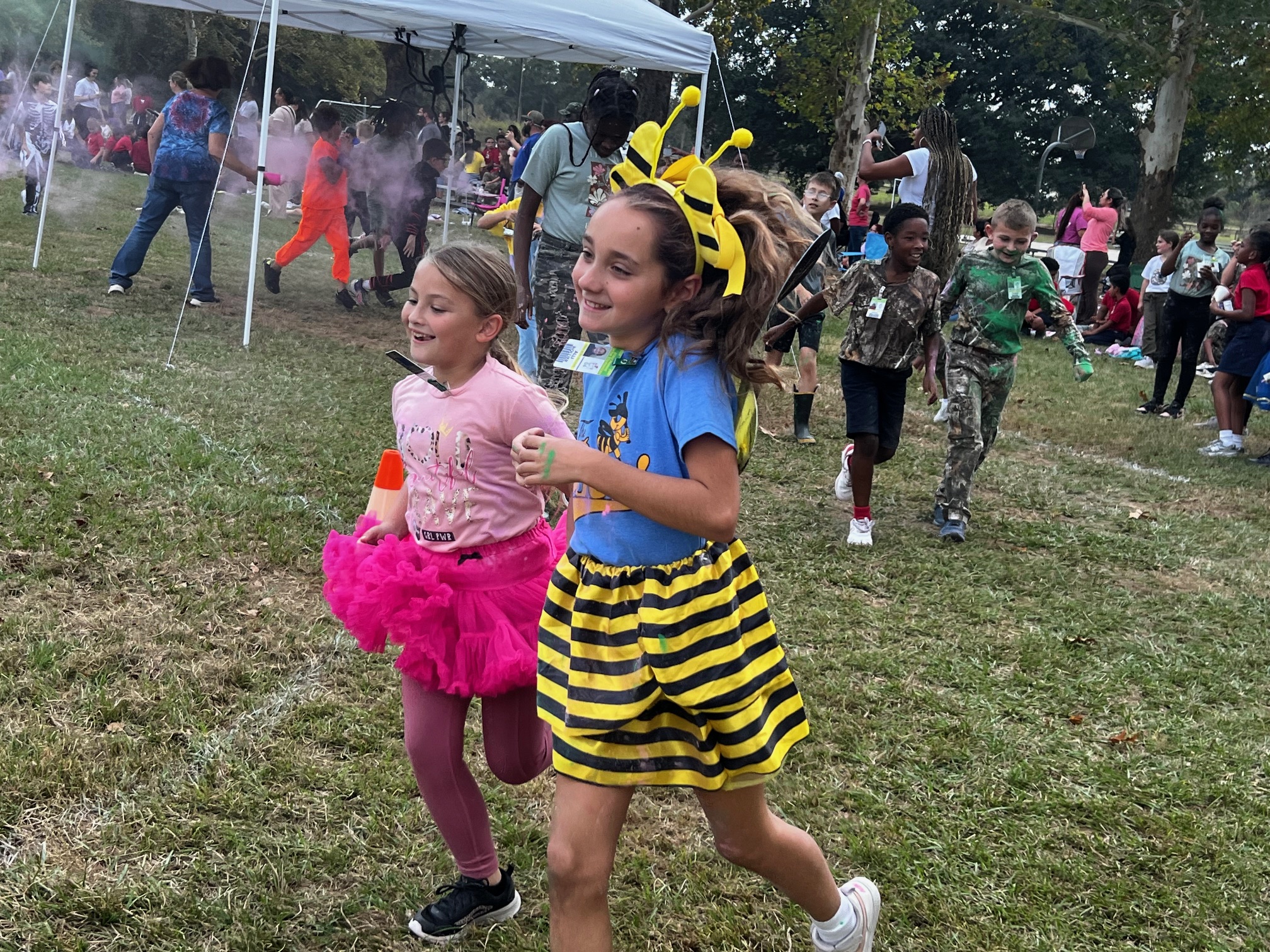 A girl dress as a bumble bee and another as a pink princess are running in Teche's October Monster Run. 