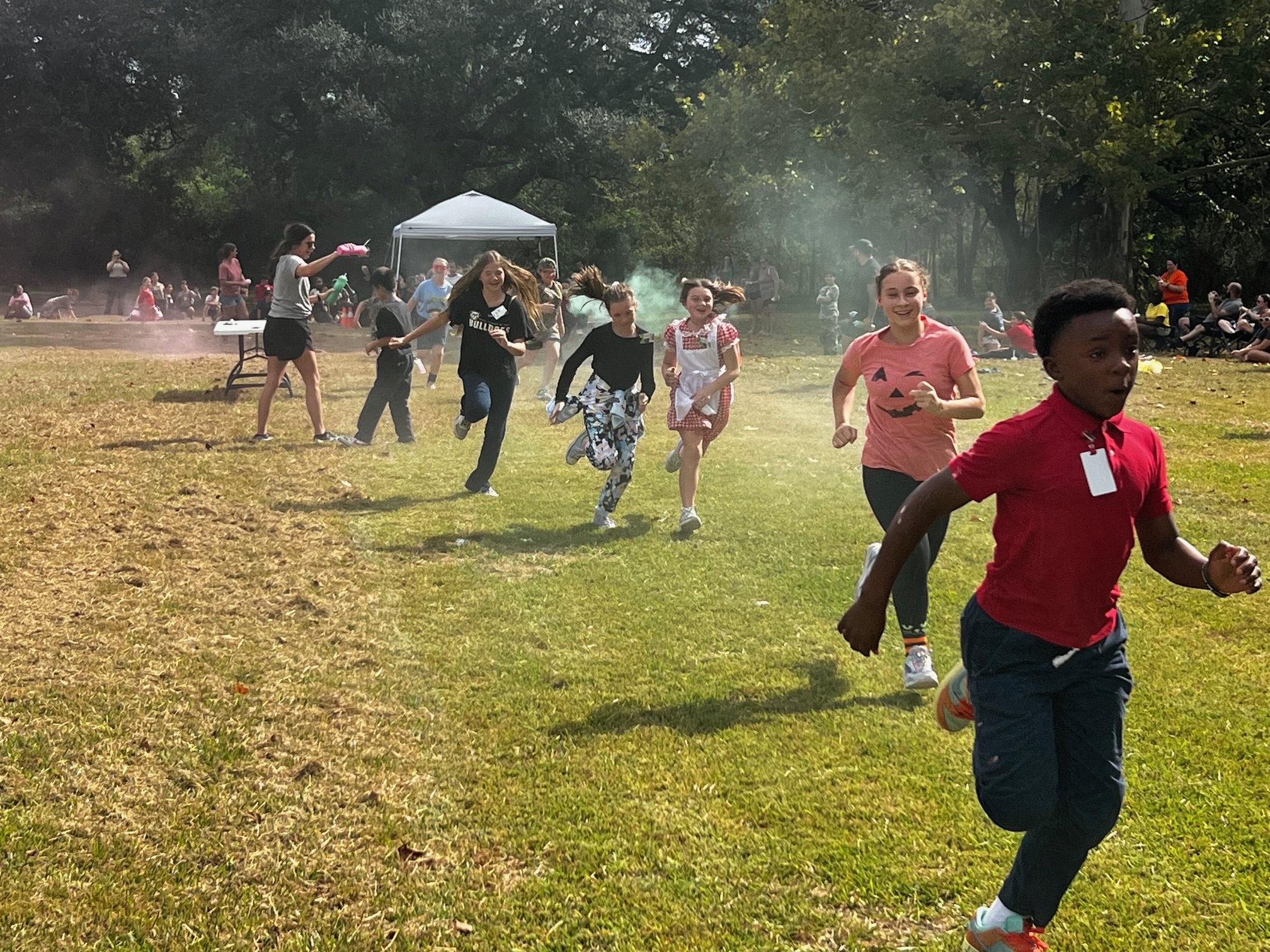 Boys and girls racing through the Monster Run. 