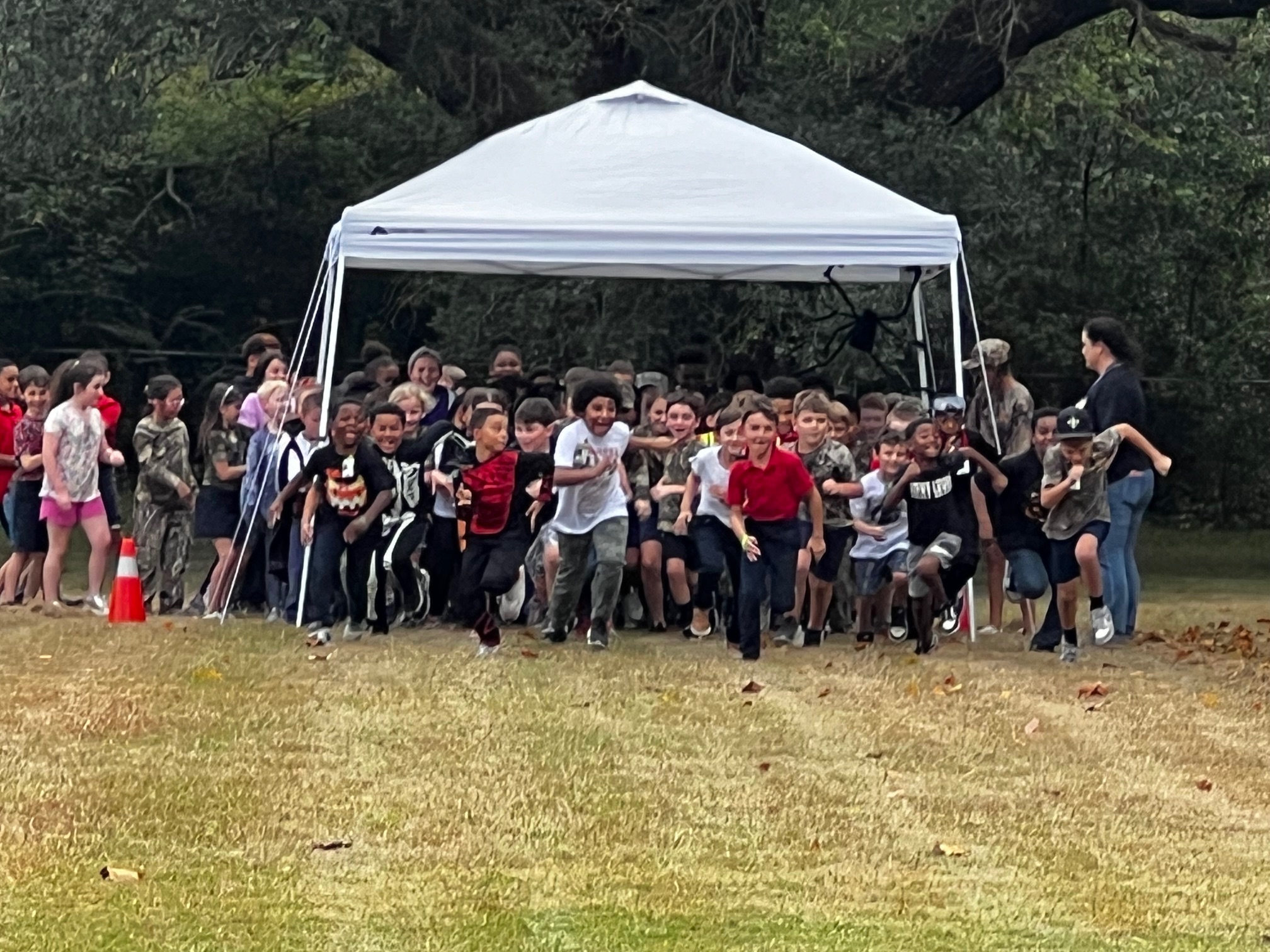 Students running from the starting line during the Monster Run. 