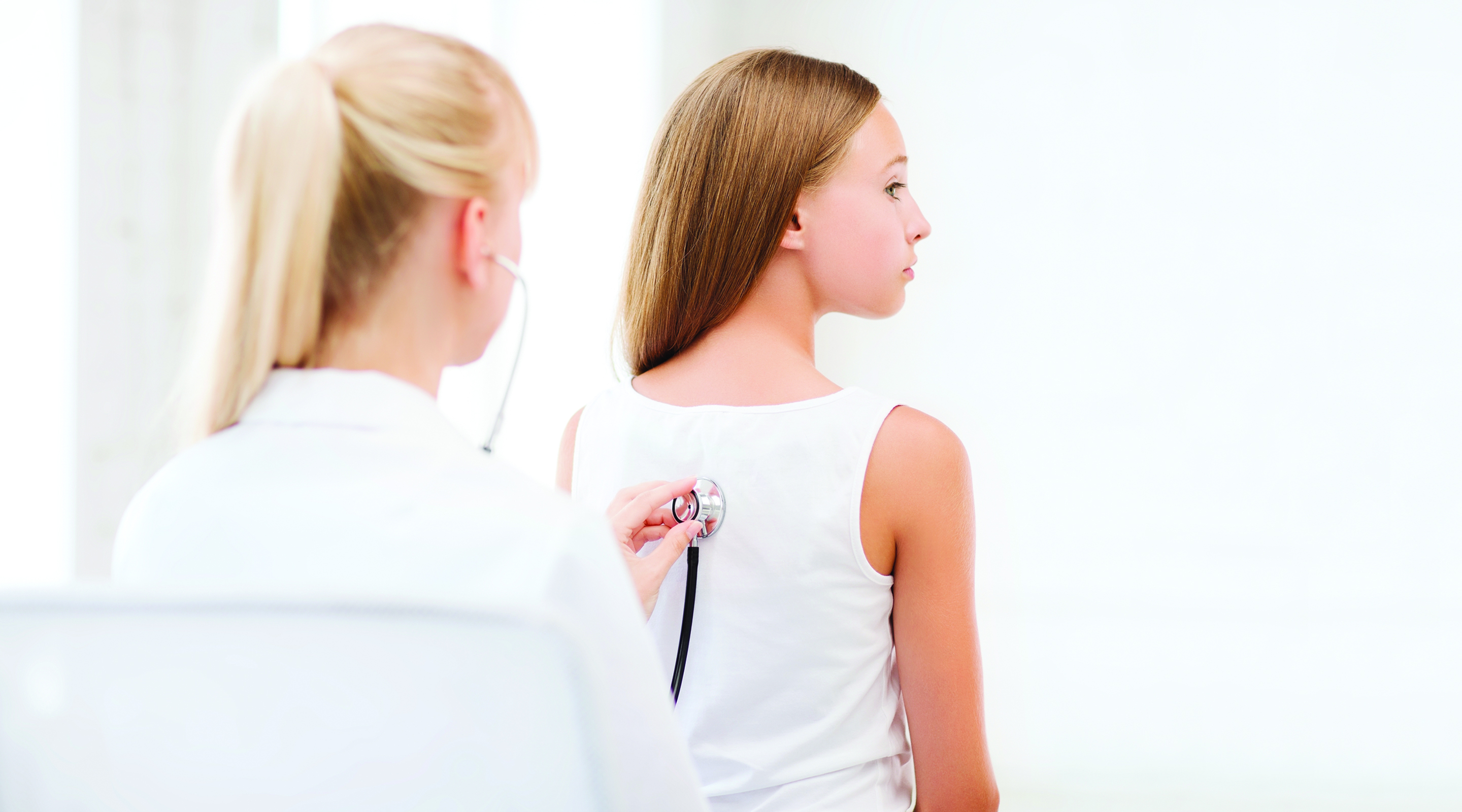Teenager Getting a Physical by a Women Doctor