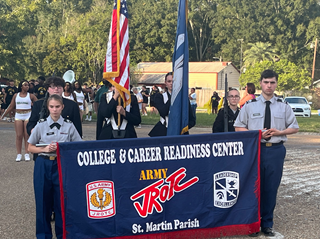 JROTC holding banner in parade