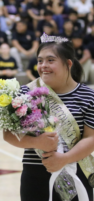 Student holding flowers