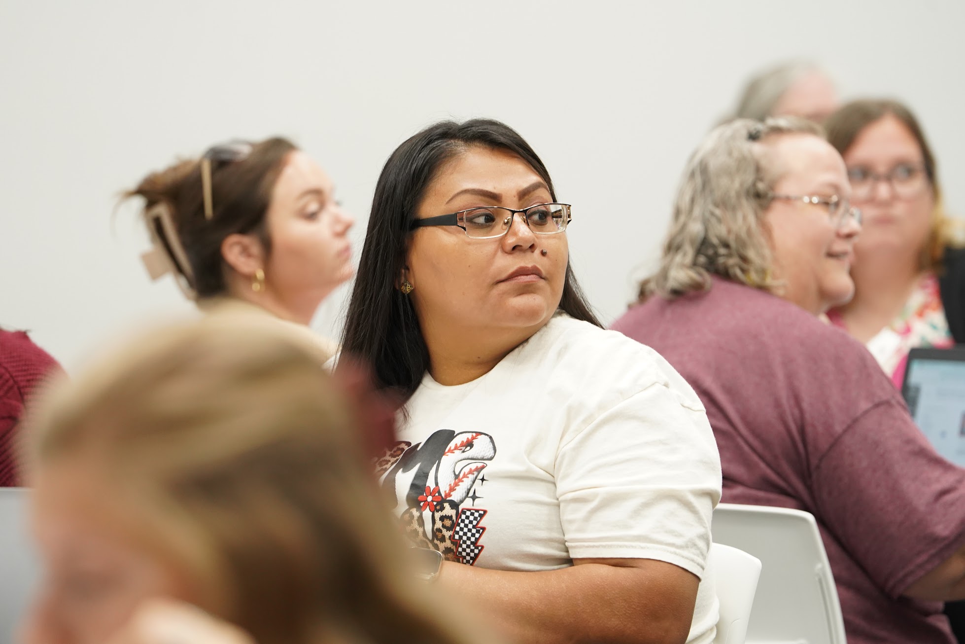 Group of participants talk with each other during Reading Academy