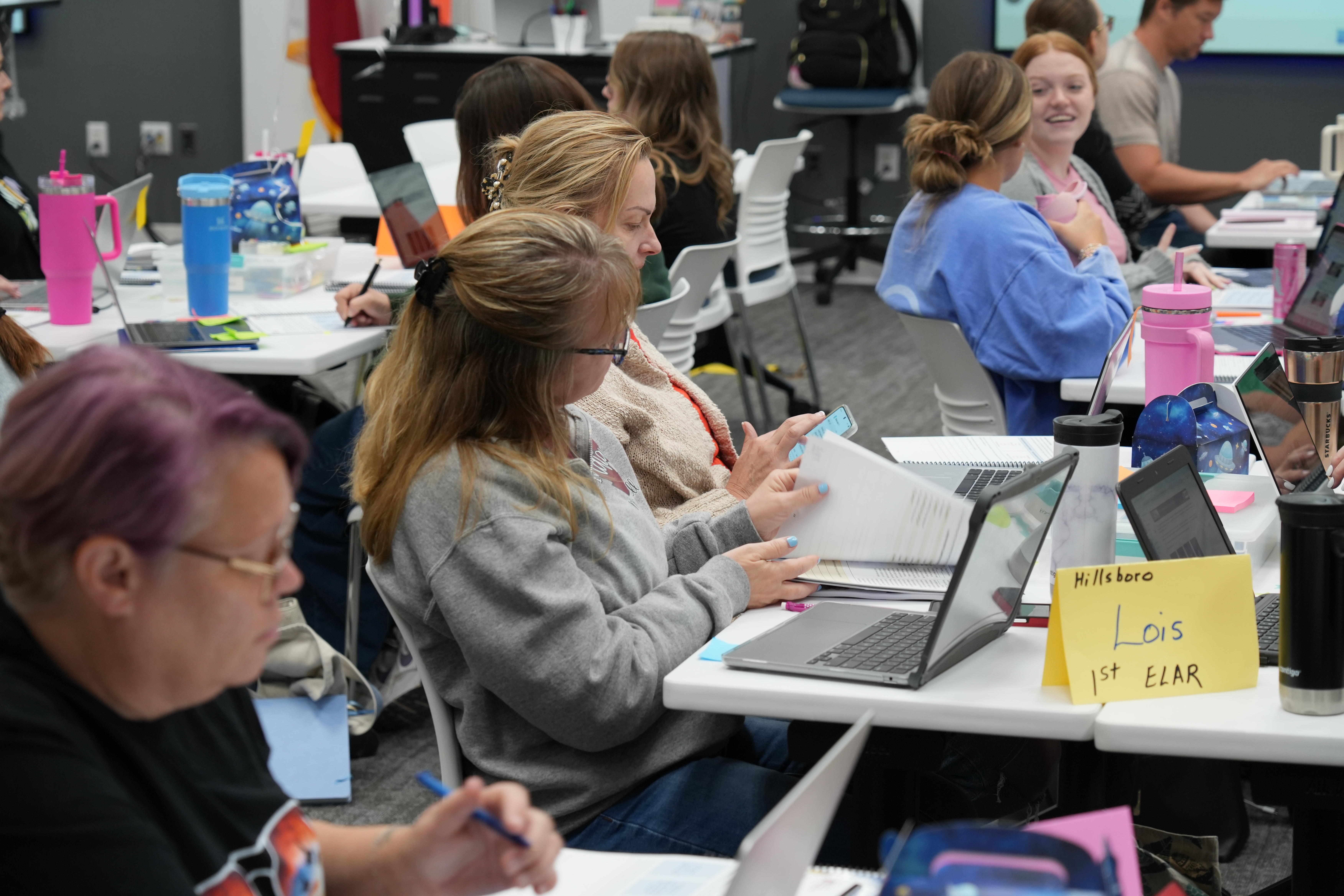 Group of participants talk with each other during Reading Academy