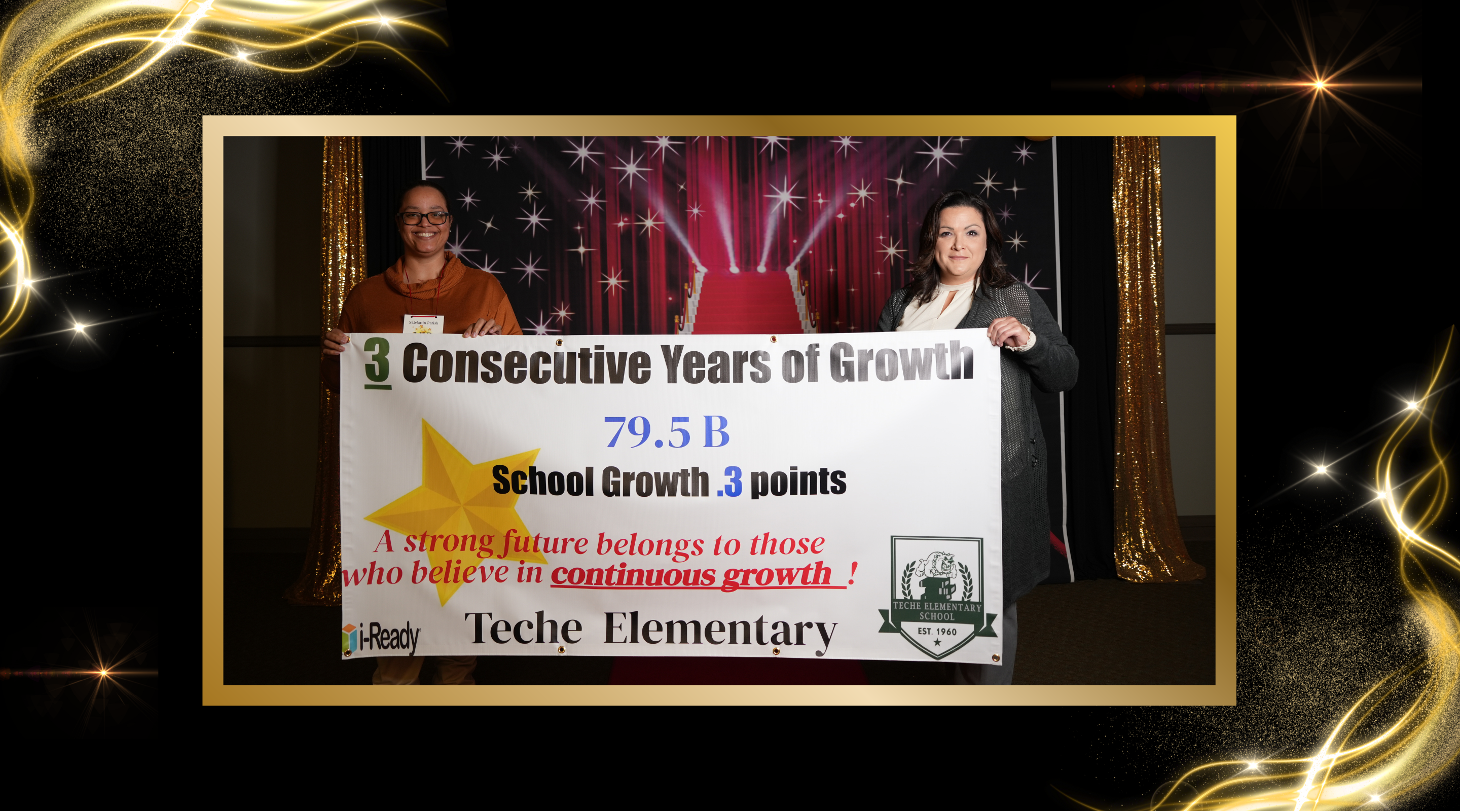 principal and assistant principal display a banner of our 2024-2025 school sps score