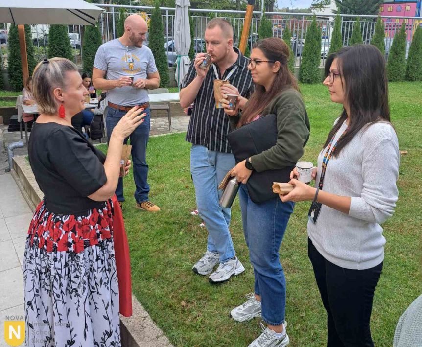 Parents chatting on the school lawn at a PTA gathering