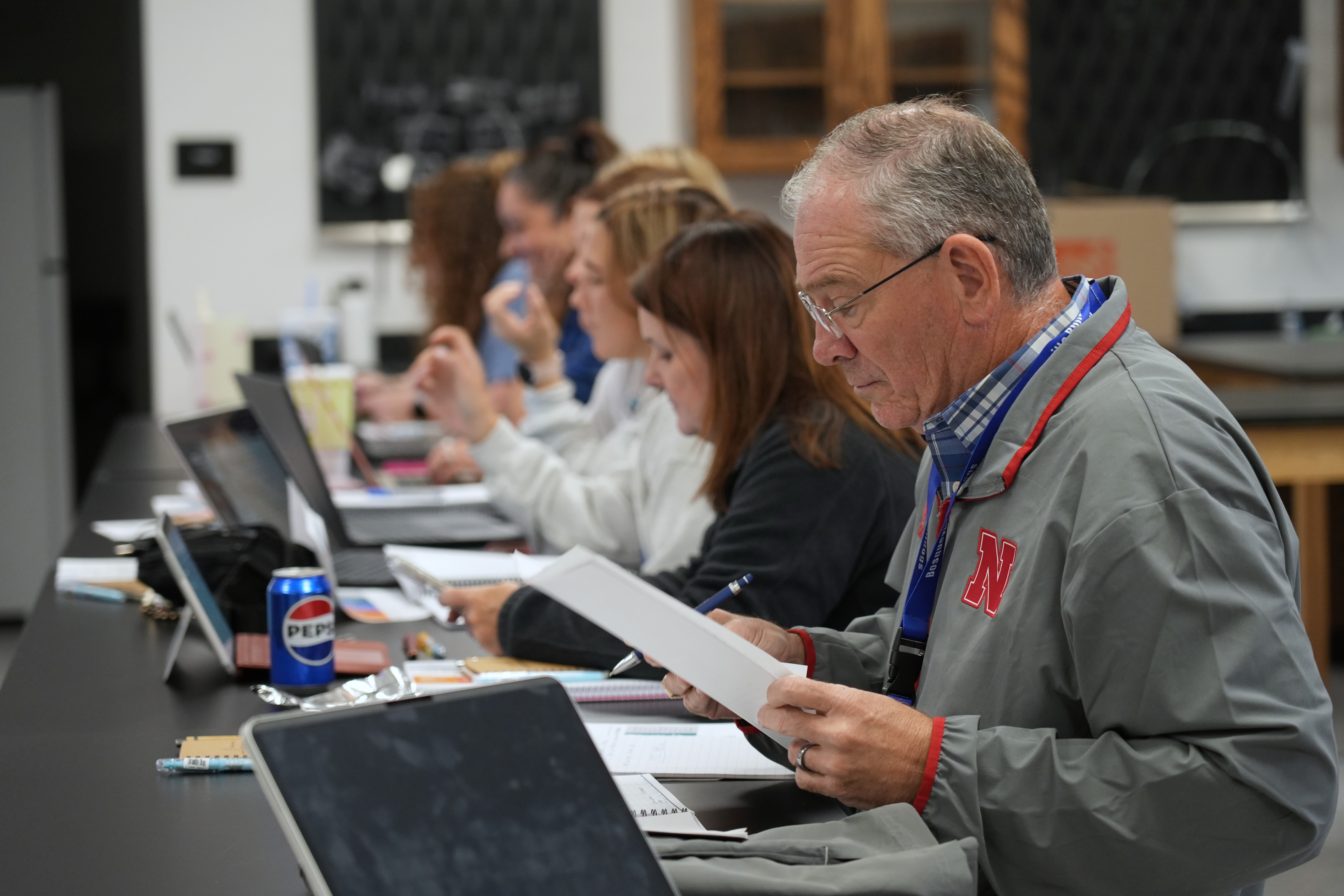 Participants take notes during a SIL presentation 
