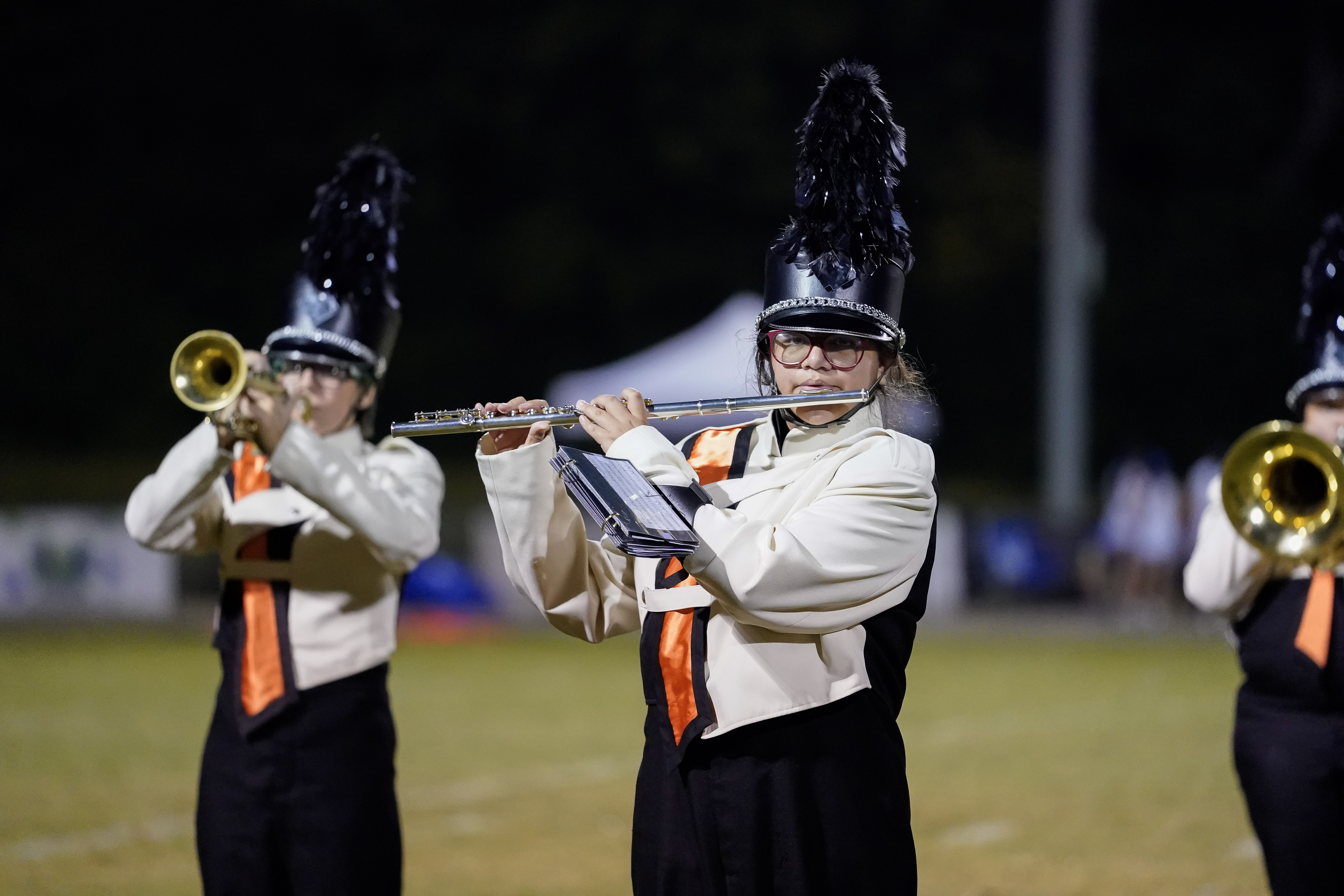 Marching band member in a white and black uniforms