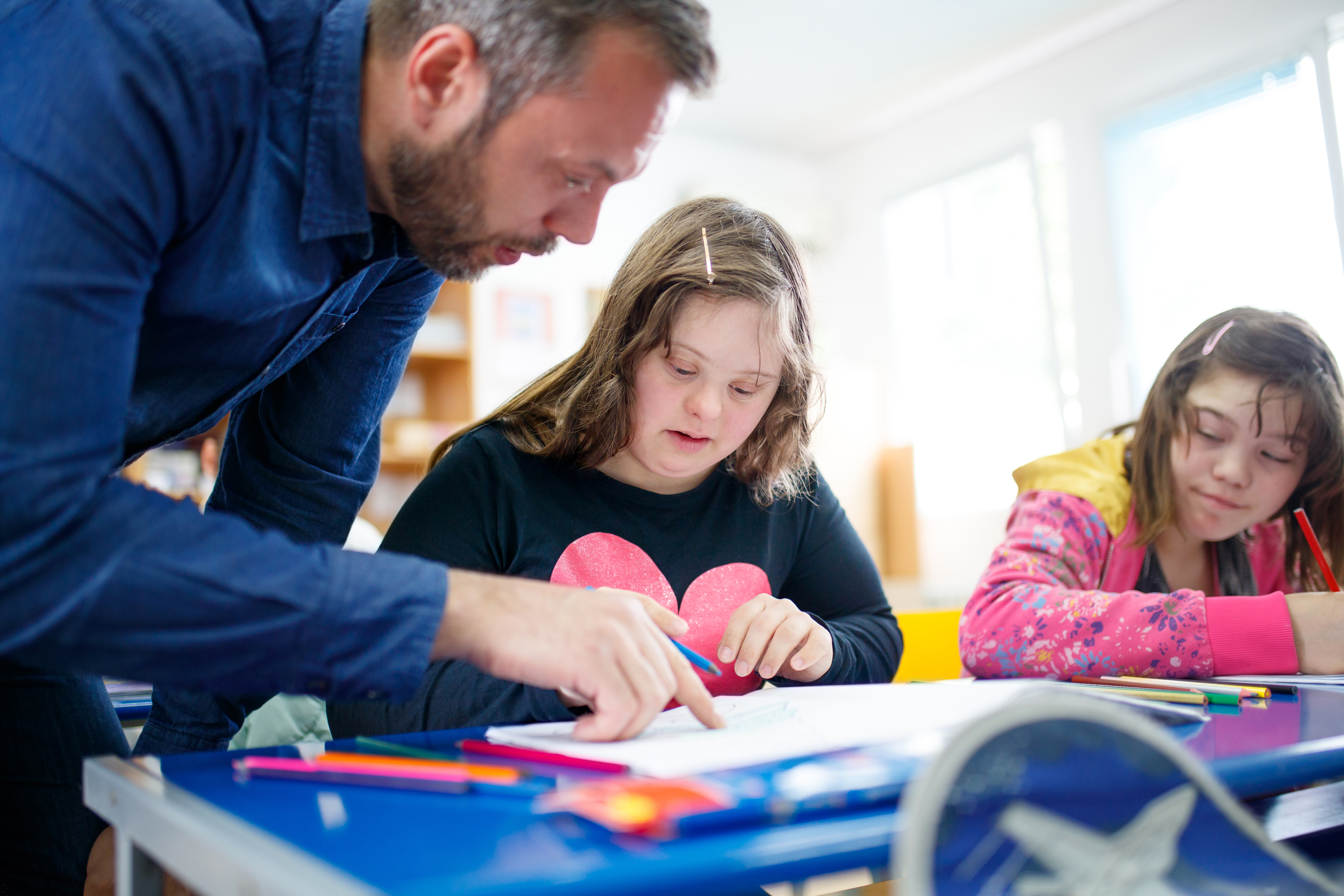 teacher working with student