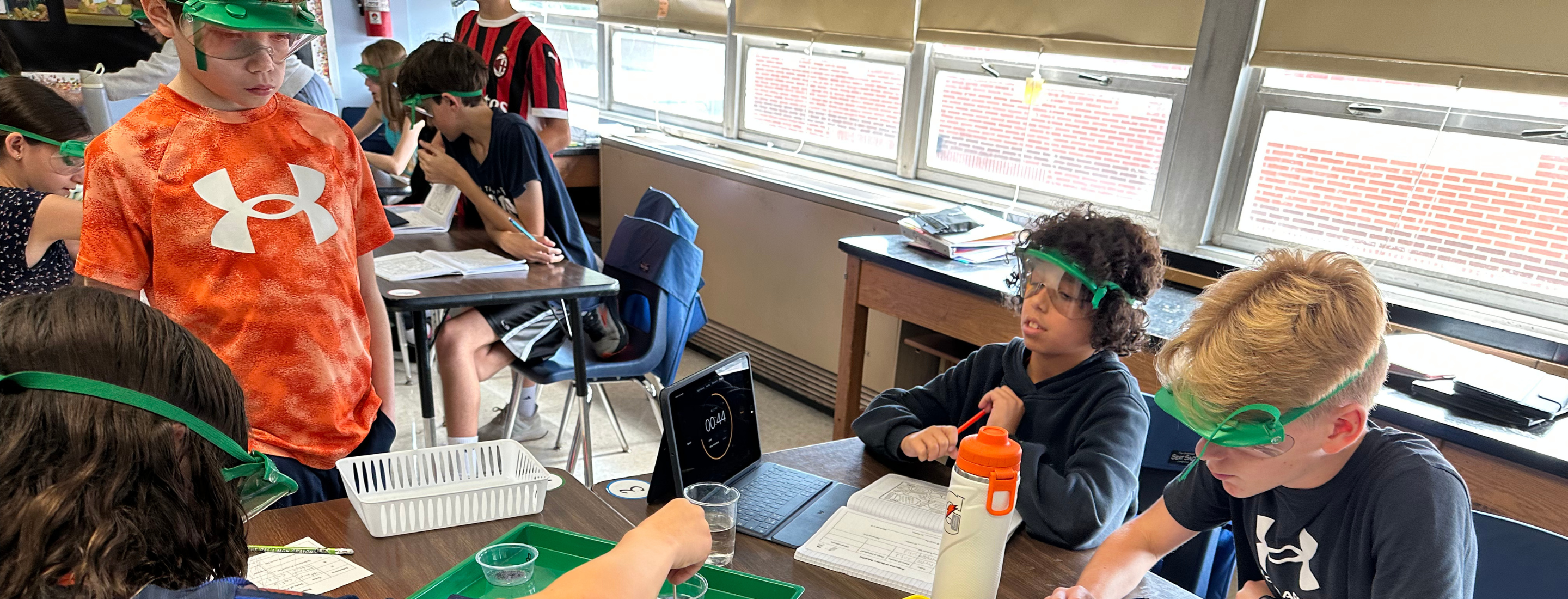 Students participating in group science experiments