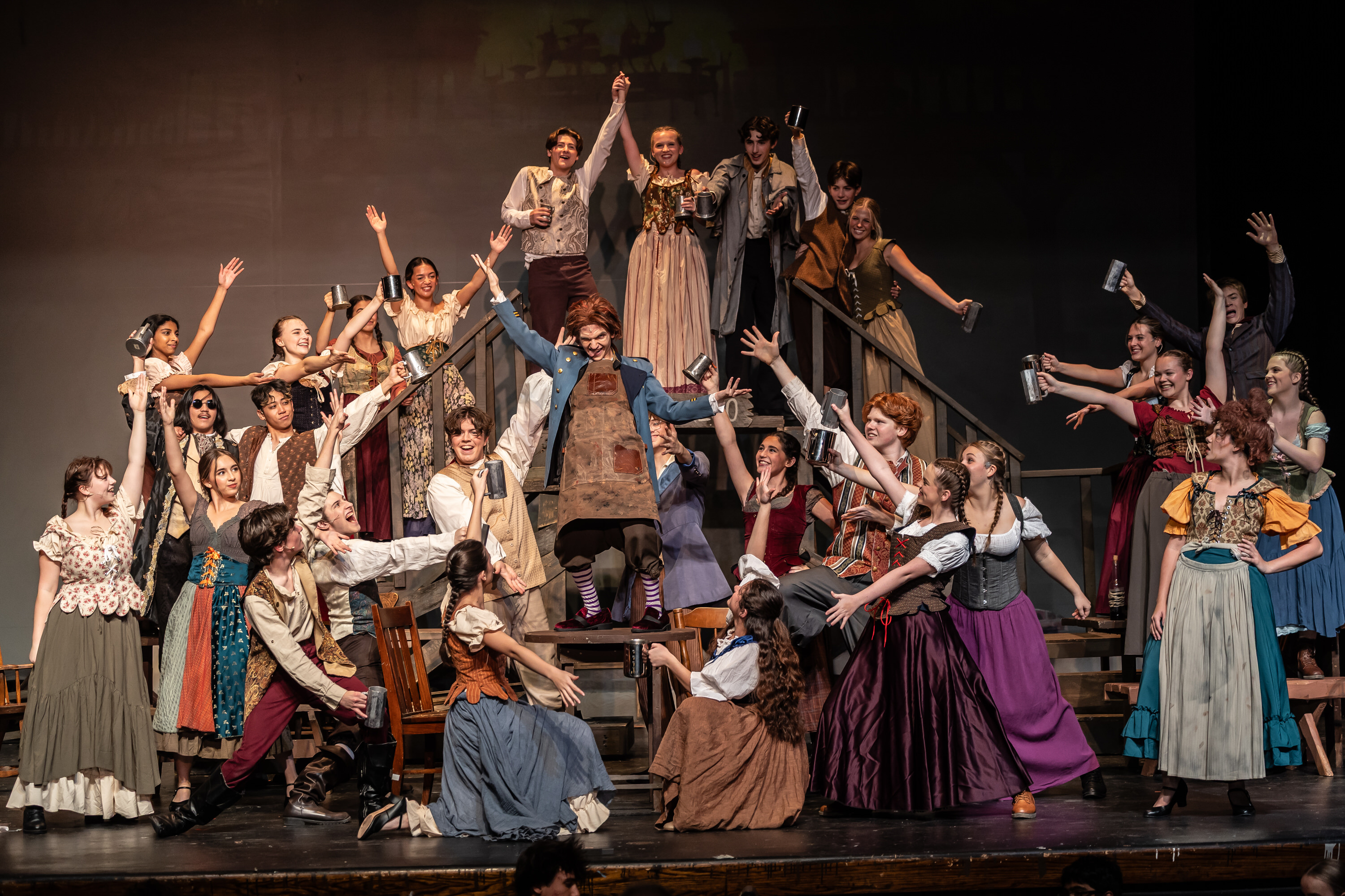 Full cast performing Master of the House on stage at LHS