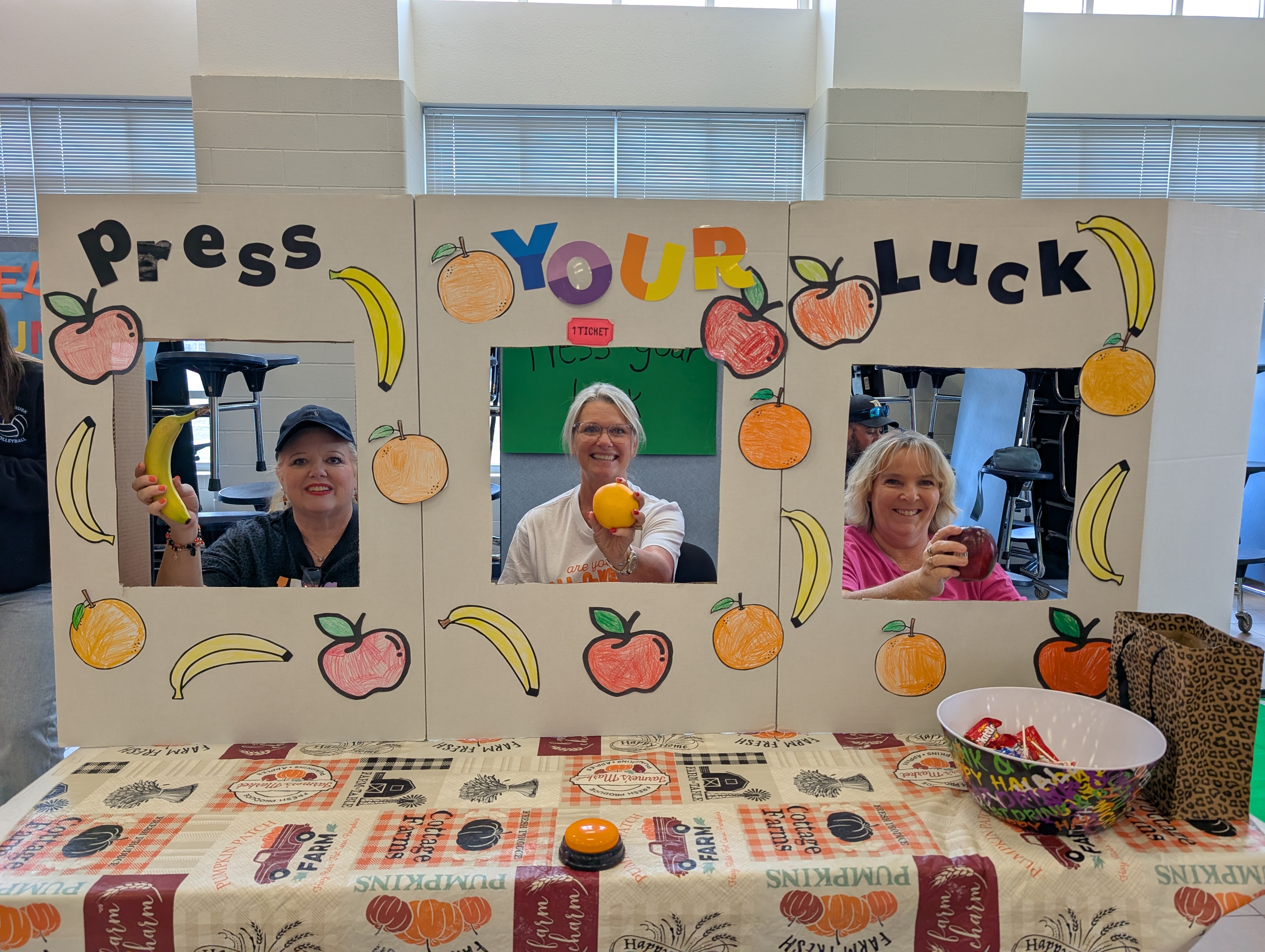 3 West Rusk Elementary teachers doing a game at a fall festival