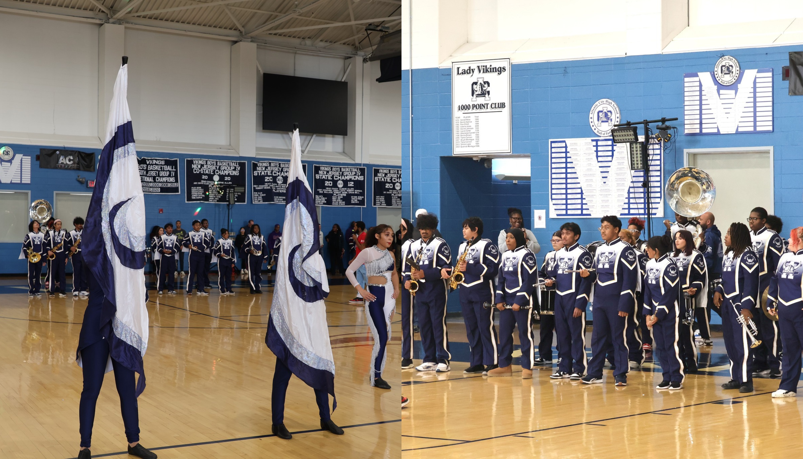 A group of students in uniform standing in a gymnasium, with a large flag and display boards visible in the background.