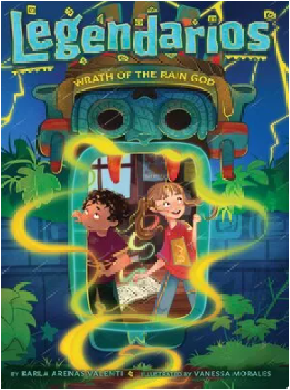 Two young children, a boy and a girl, are standing in front of a large, colorful mask-like structure in a lush, tropical-looking environment with palm trees and other vegetation in the background.