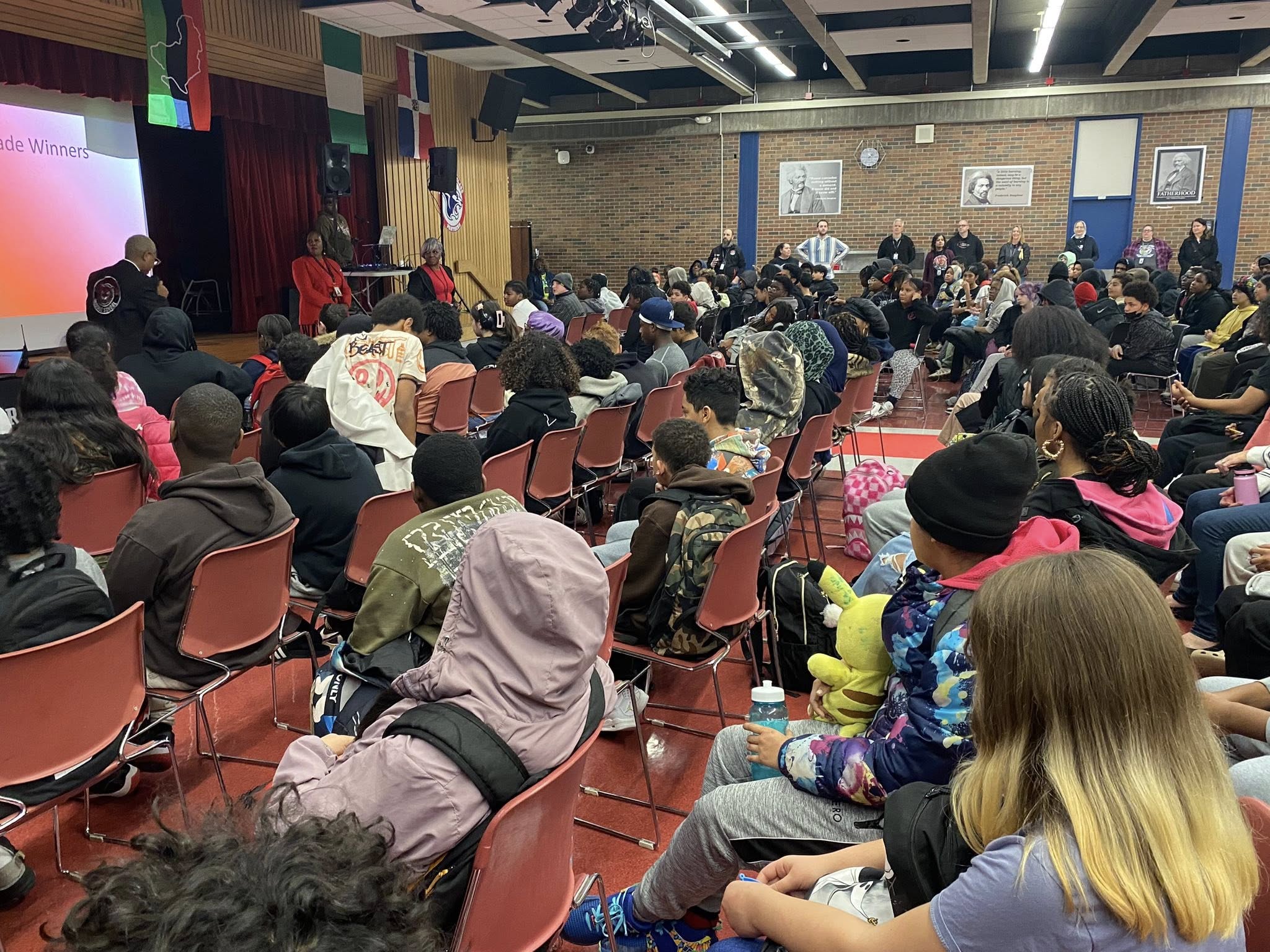 Student gather in the school's cafeteria for a Character Attribute Assembly