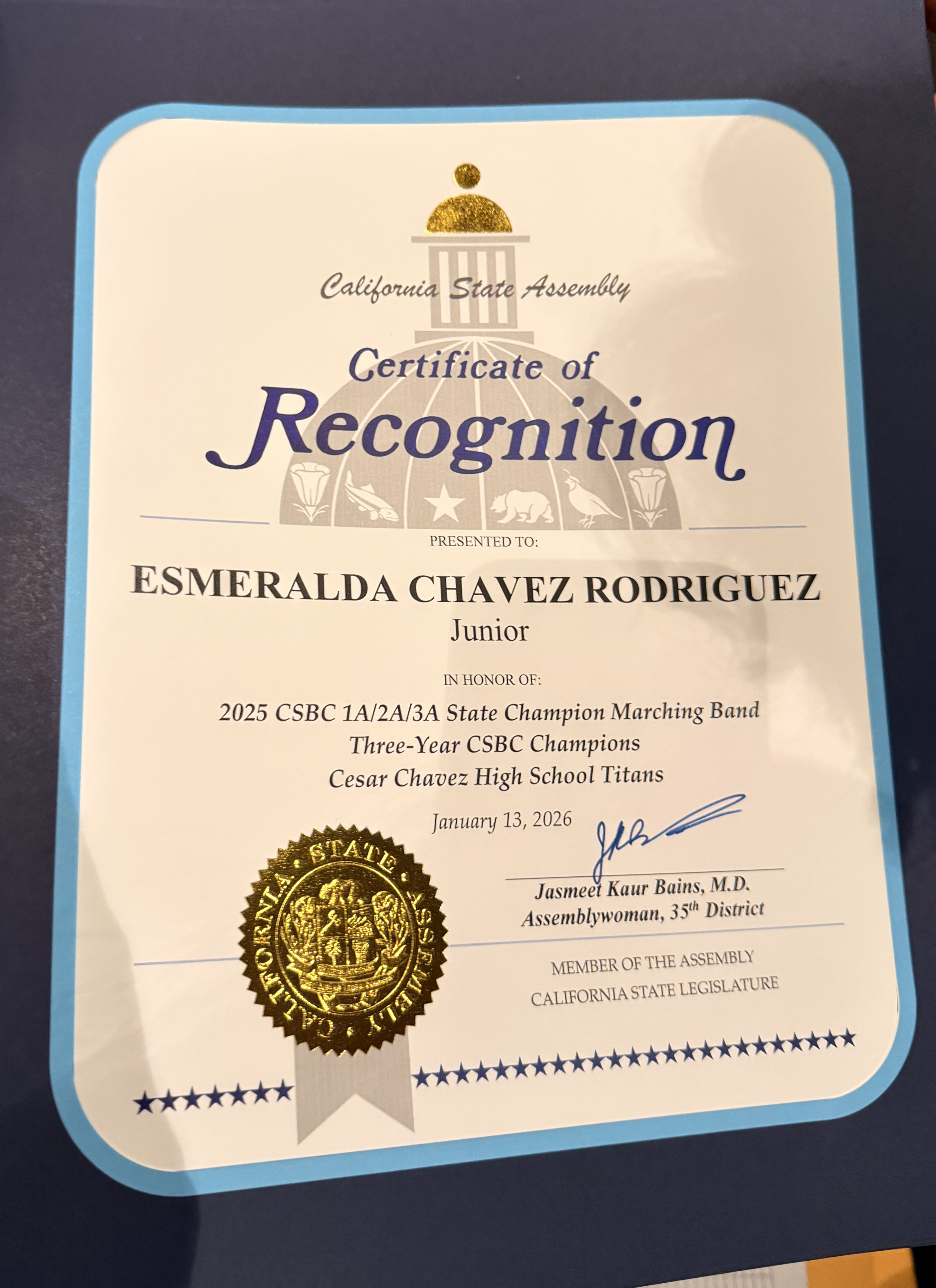 The image shows a Certificate of Recognition awarded to Esmeralda Chavez Rodriguez for her achievements with the Cedar Chavez High School Titans marching band, including their three-year CSB championship.