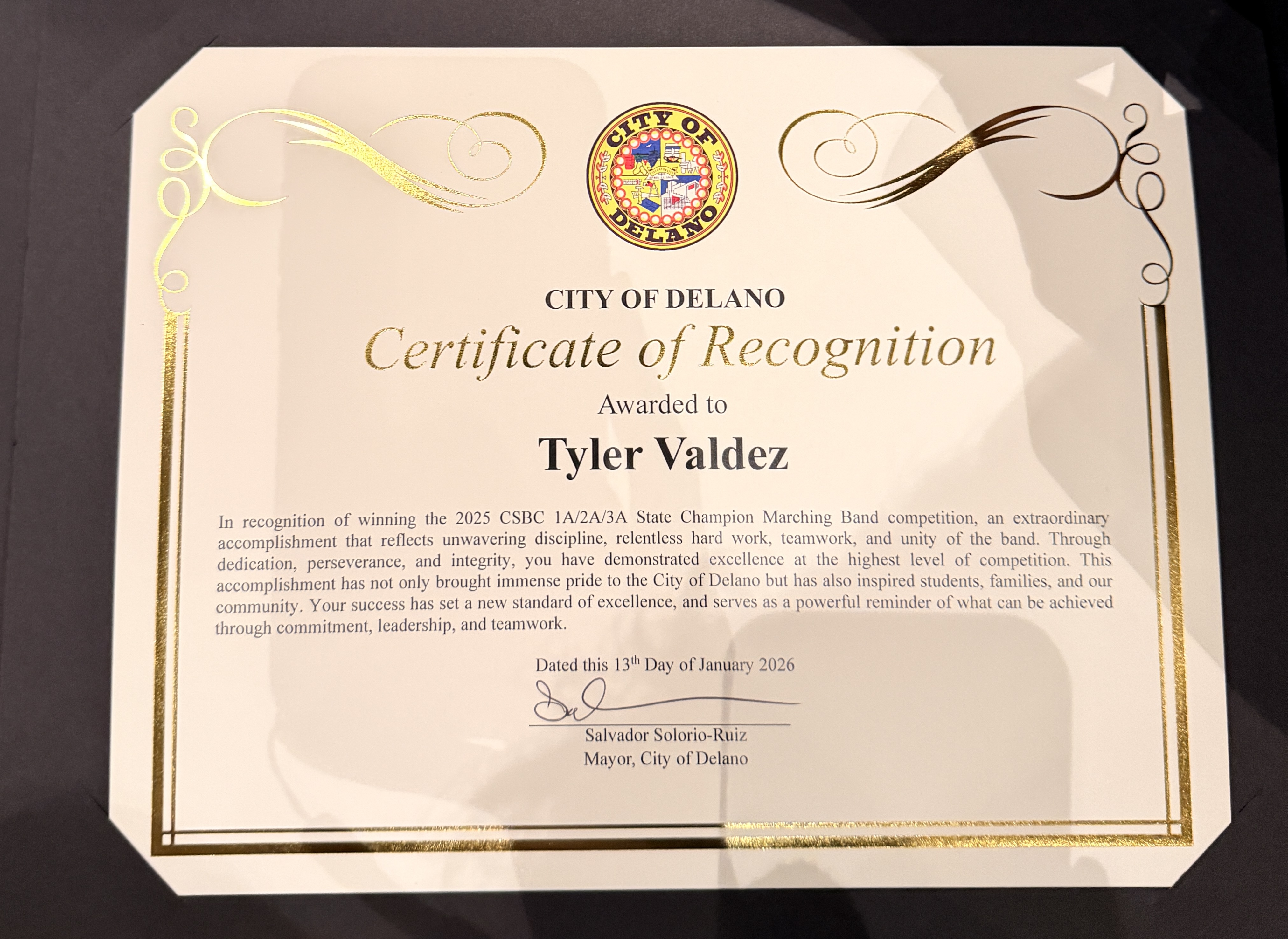 A certificate of recognition awarded to Tyler Valdez by the City of Delano, featuring the city's seal and ornate decorative elements.