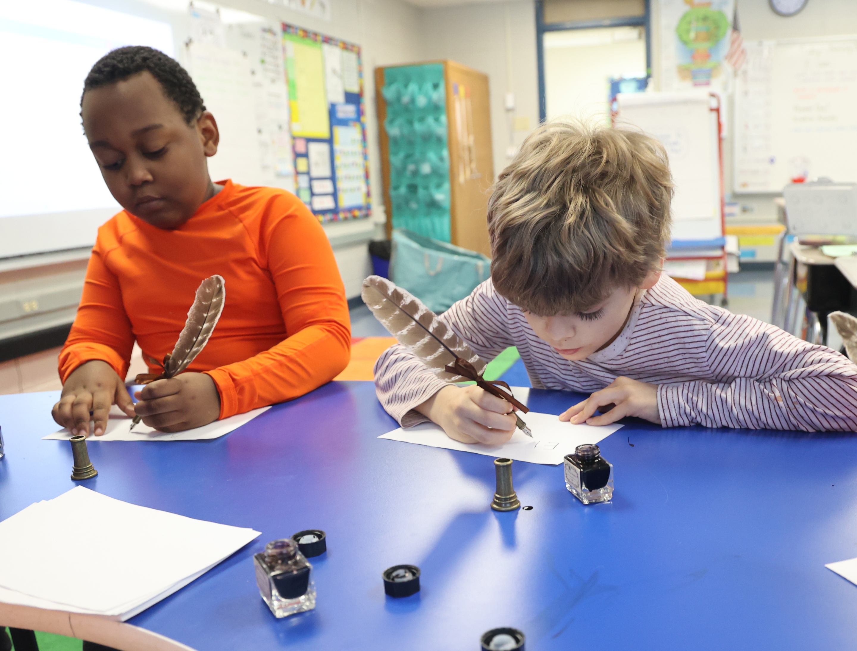 students using feather pens
