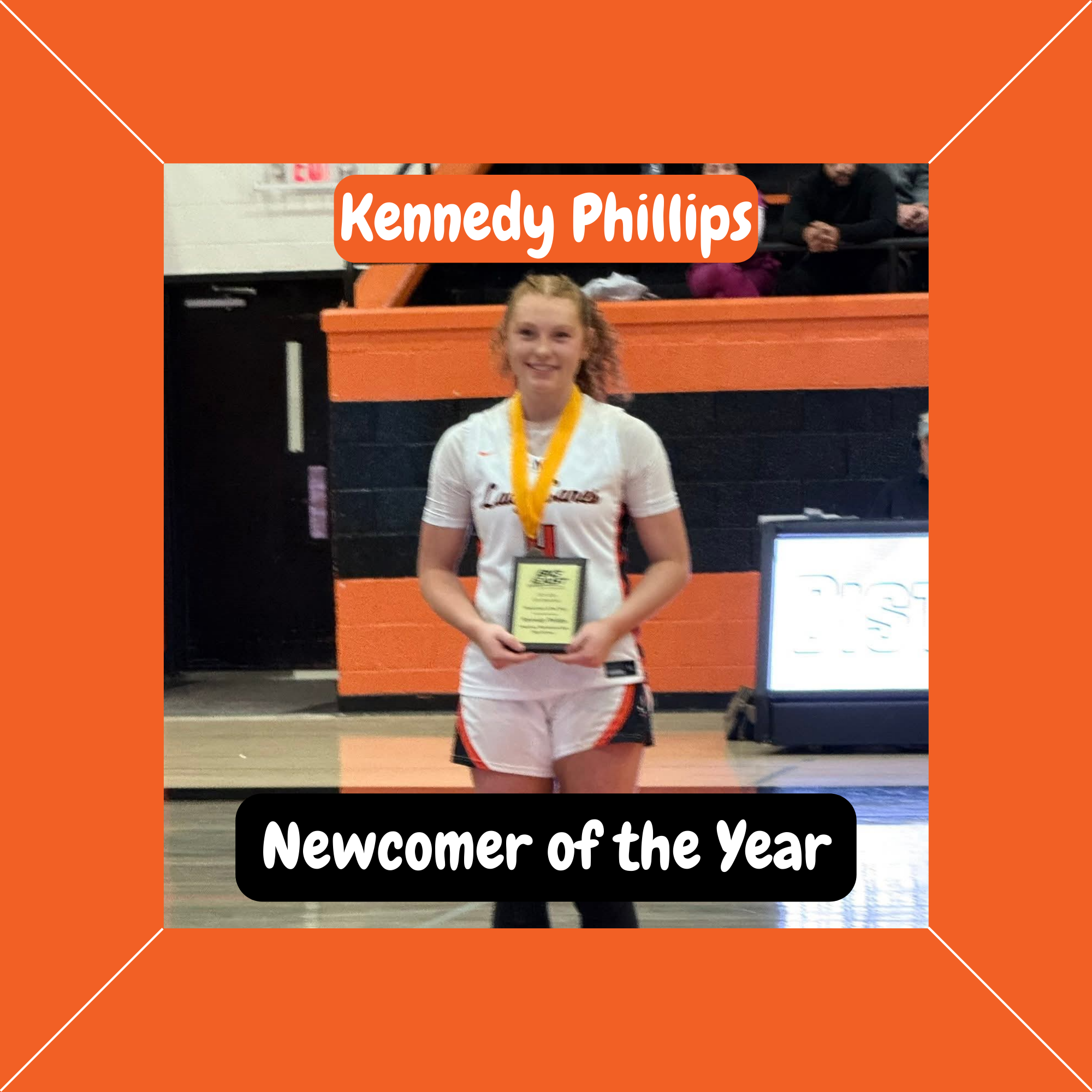 Lady Canes basketball player Kennedy Phillips holds her Newcomer of the Year award.