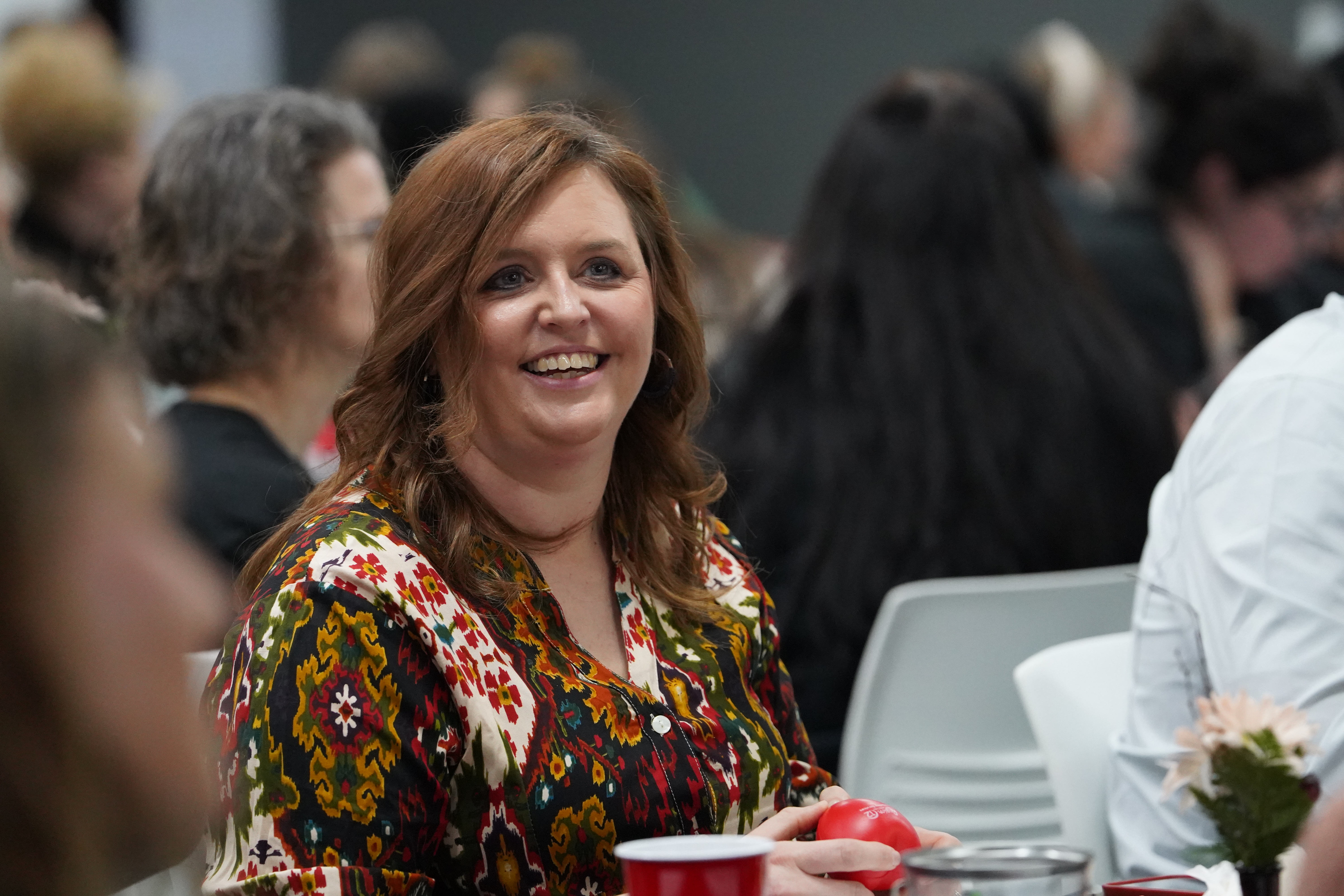 Woman laughs during an ESC Region 12 training session