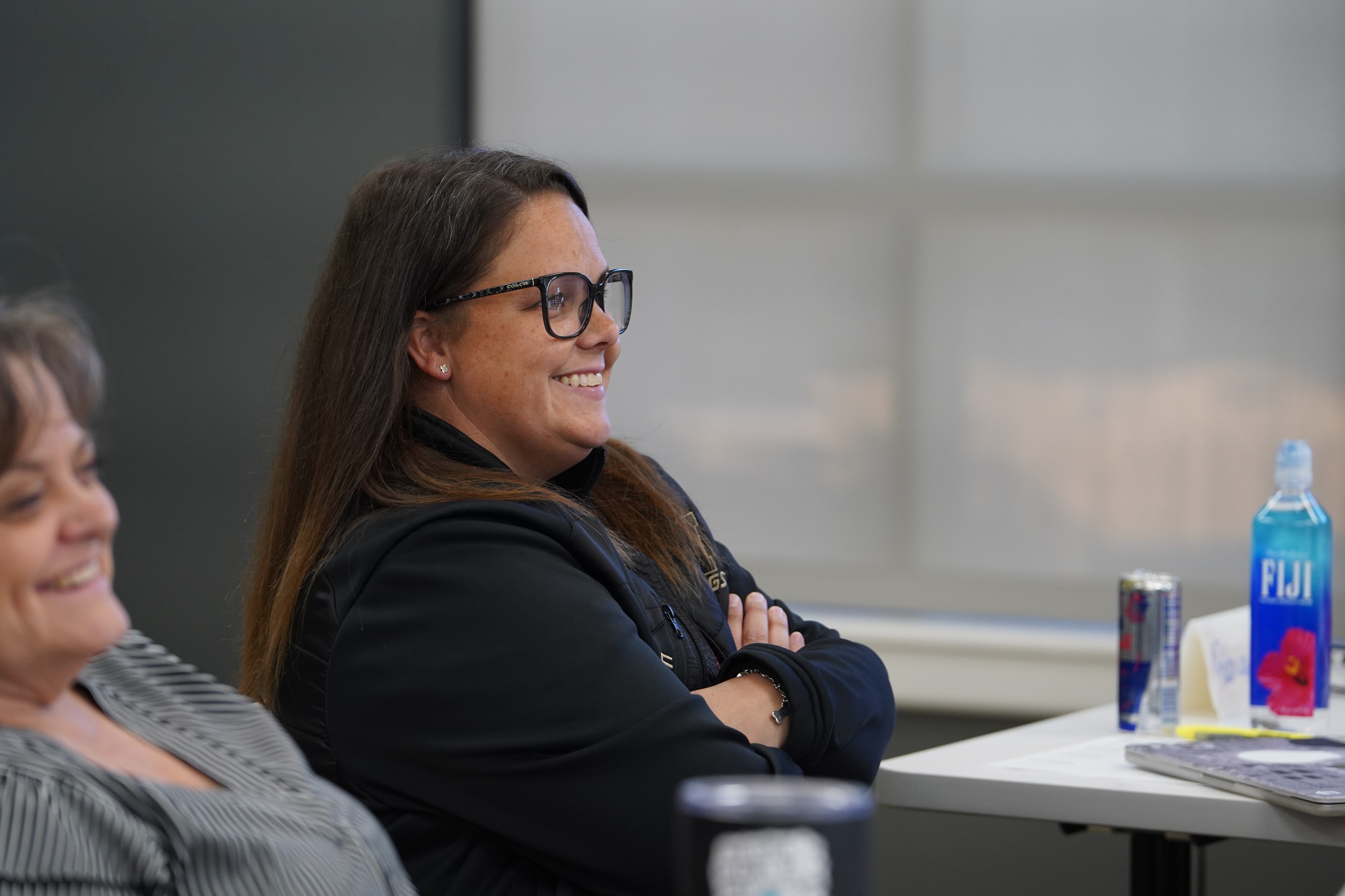Woman laughs during an ESC Region 12 training session