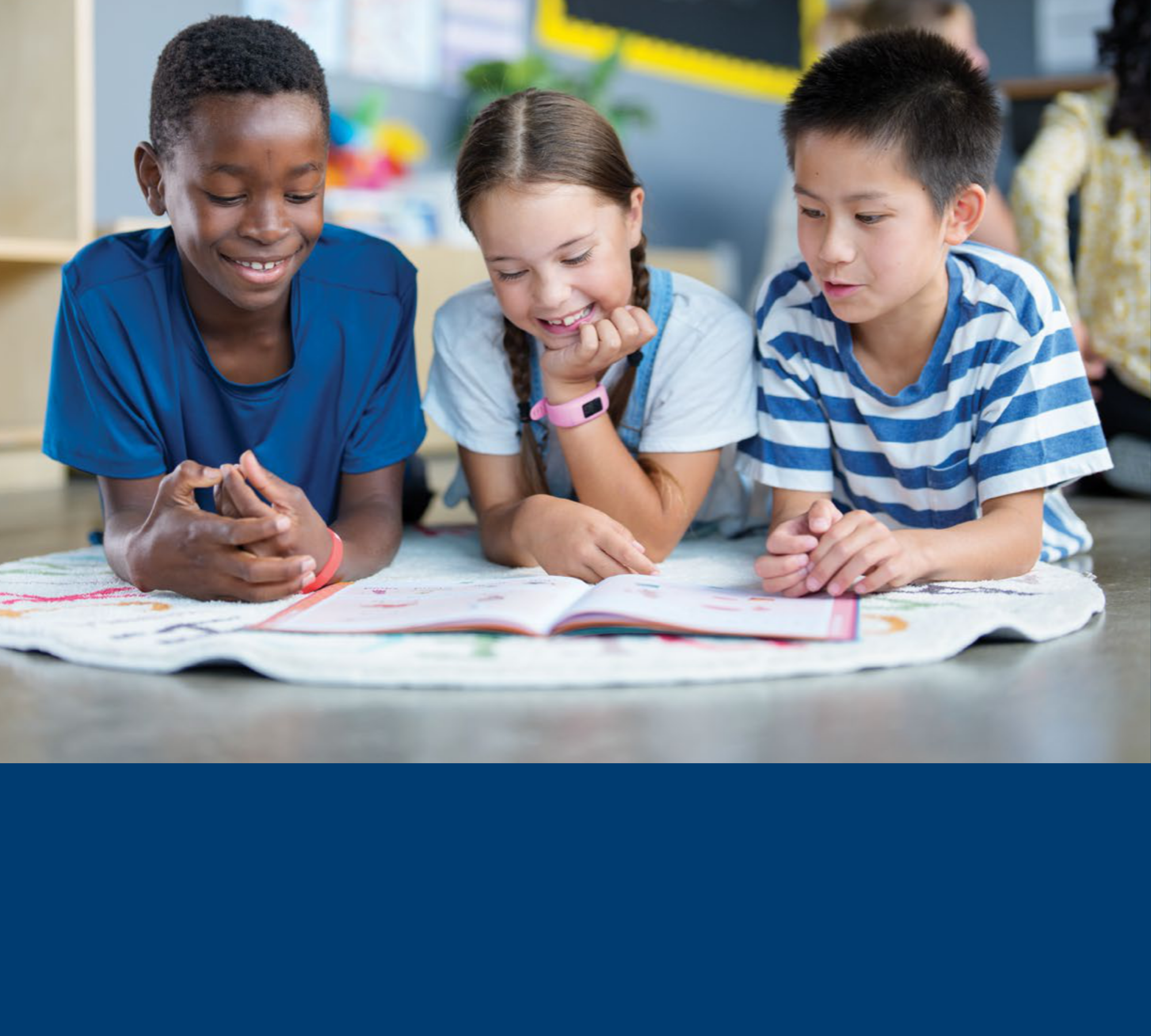 Students reading a book together