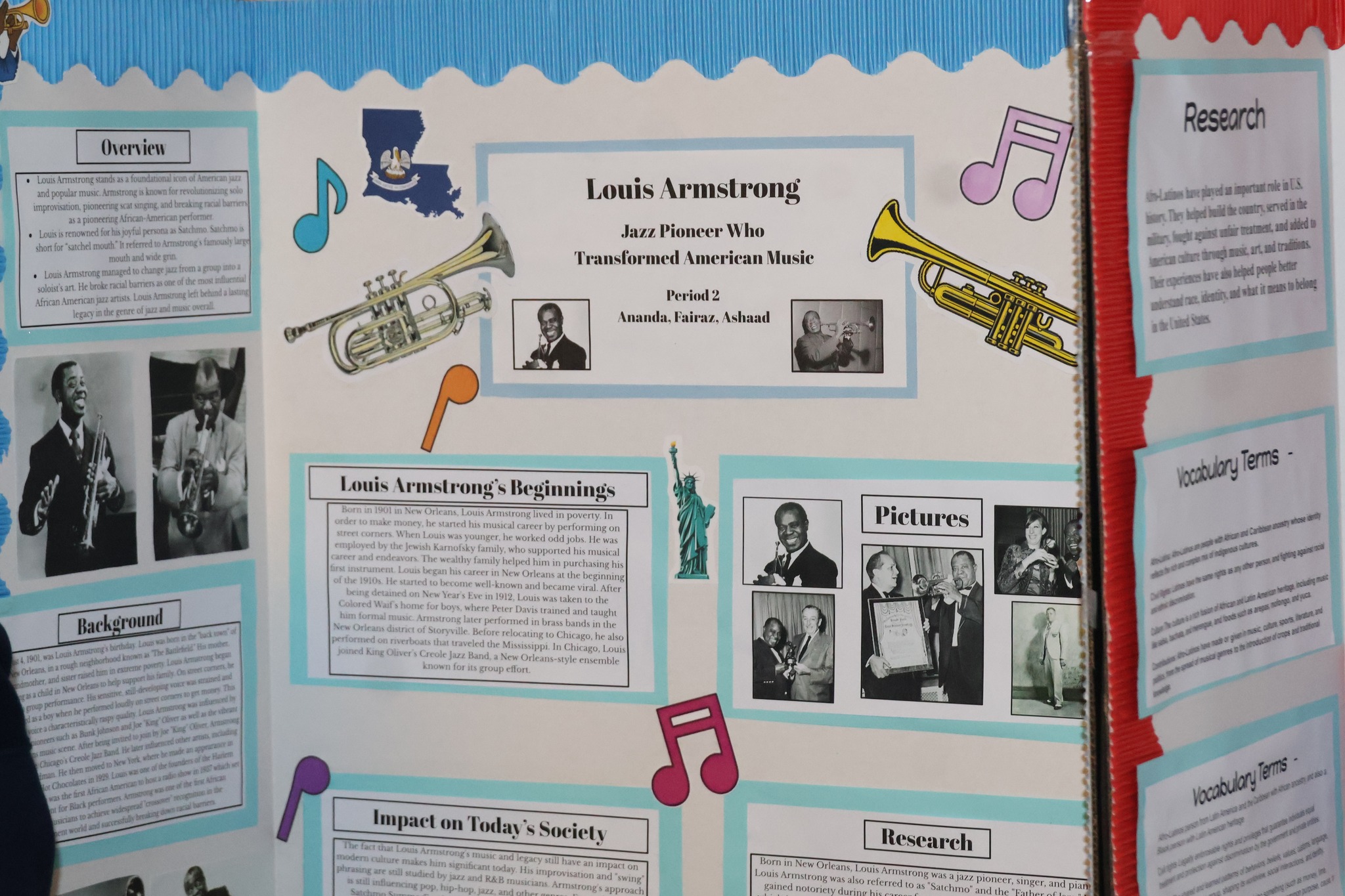 The image is a display board featuring information and photographs related to the jazz musician Louis Armstrong, including details about his life and career.