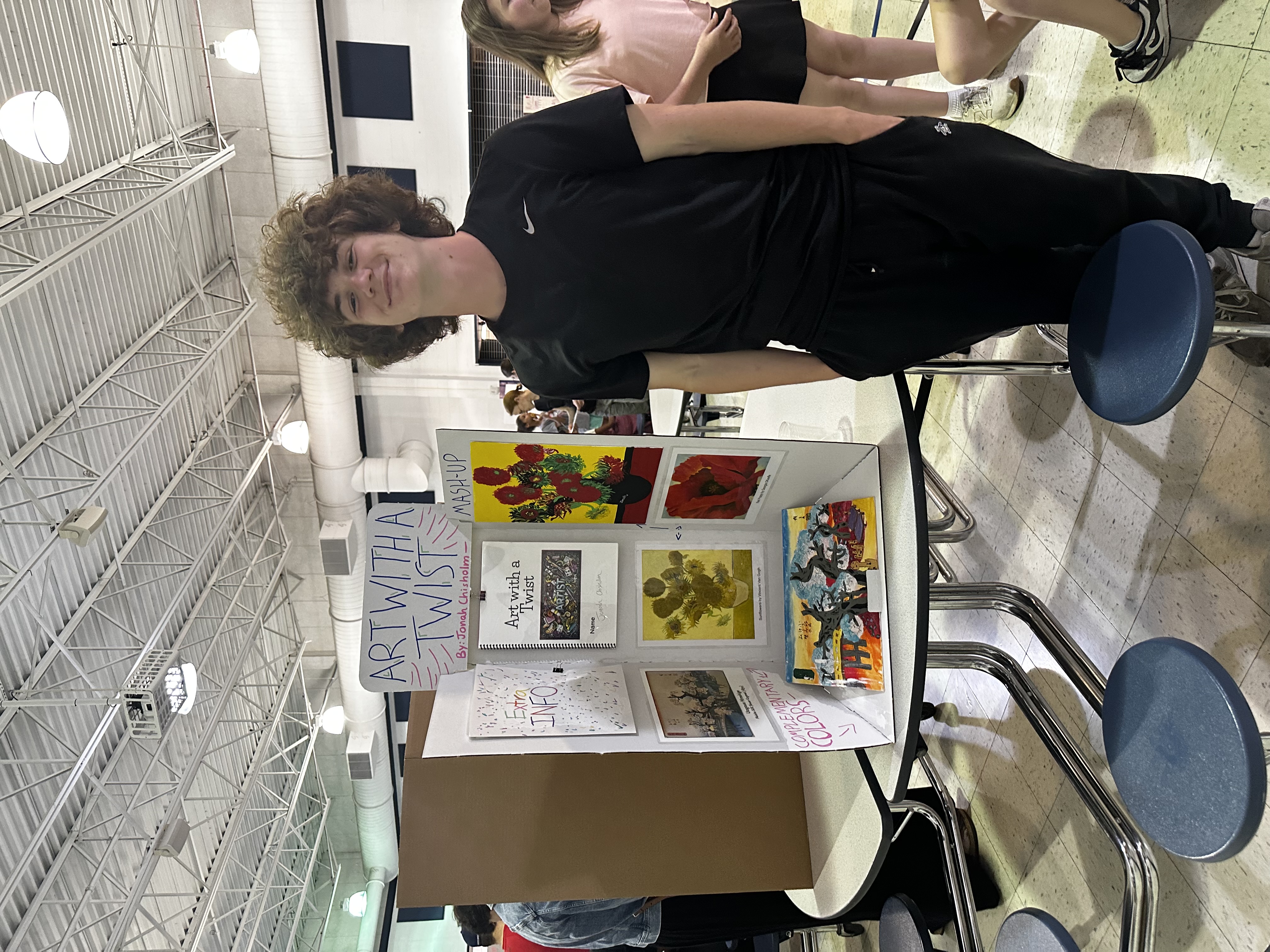 Students showing off their art project at Frontier Middle's Independent Project Night