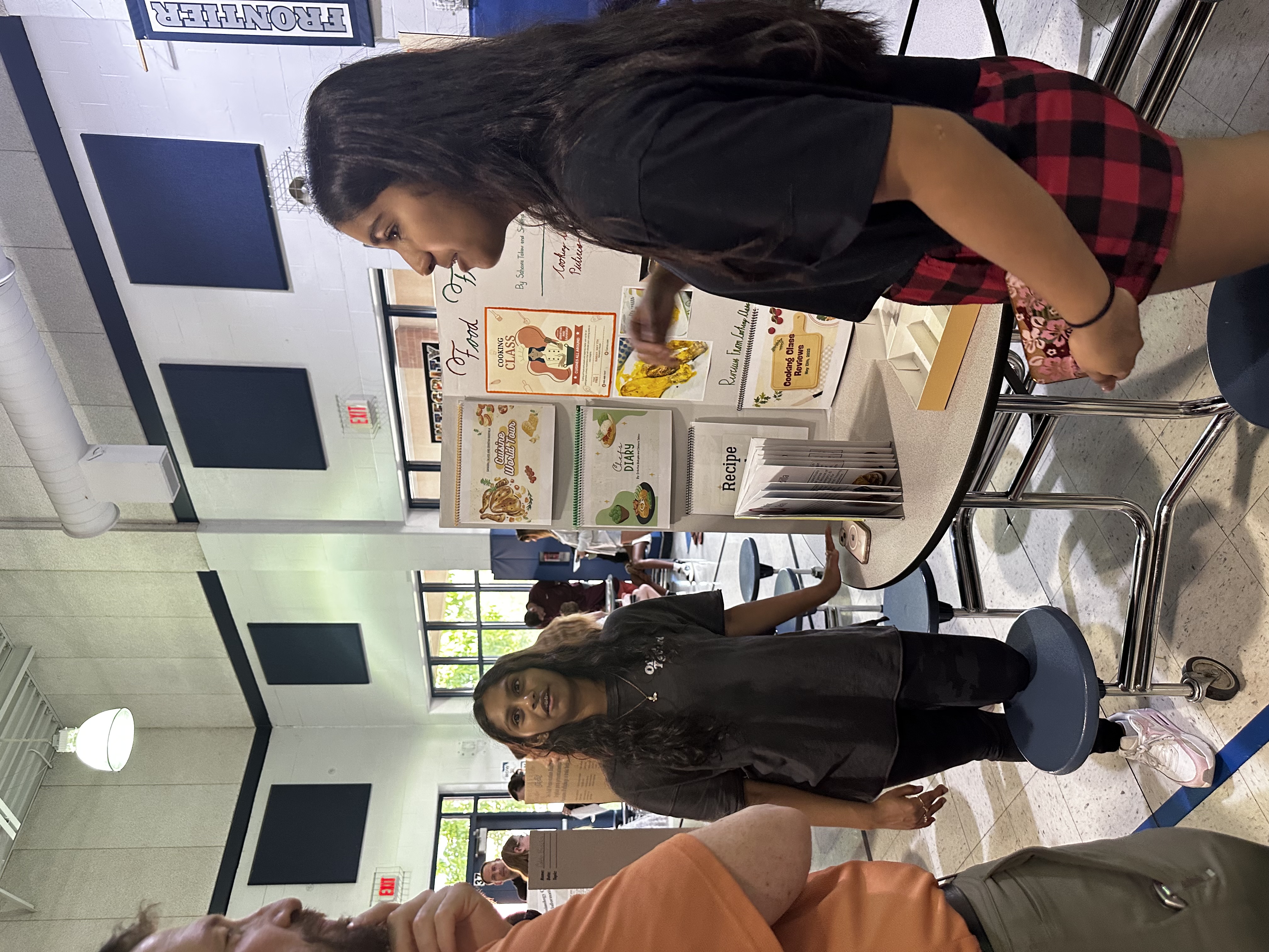 Students showing off their Food Frenzy Project at Frontier Middle's Independent Project Night