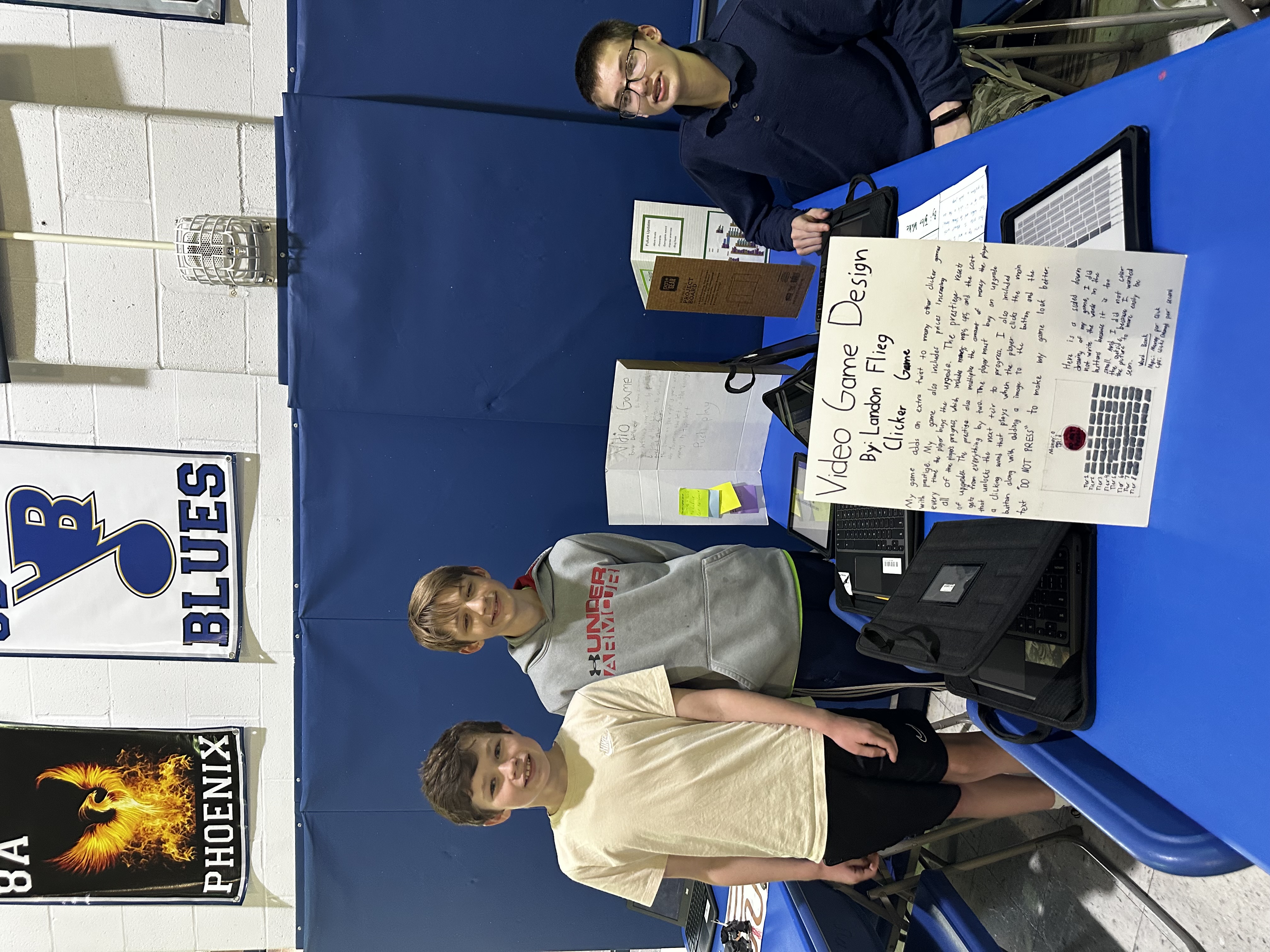 Students showing off their Video Game Design at Frontier Middle's Independent Project Night