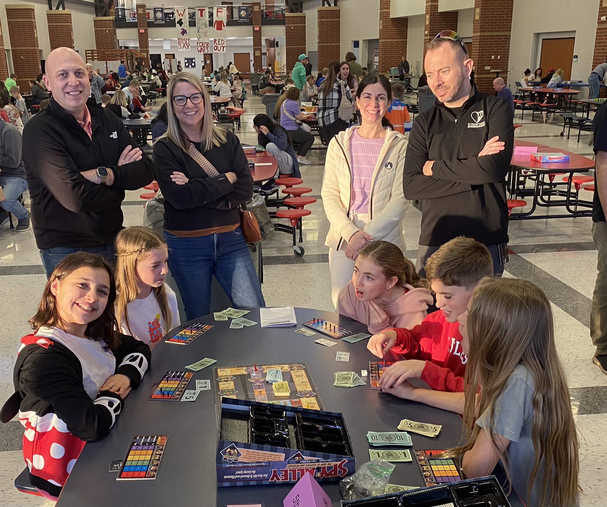 Students teaching their parents how to play Spy Ally at the Horizons Family Night