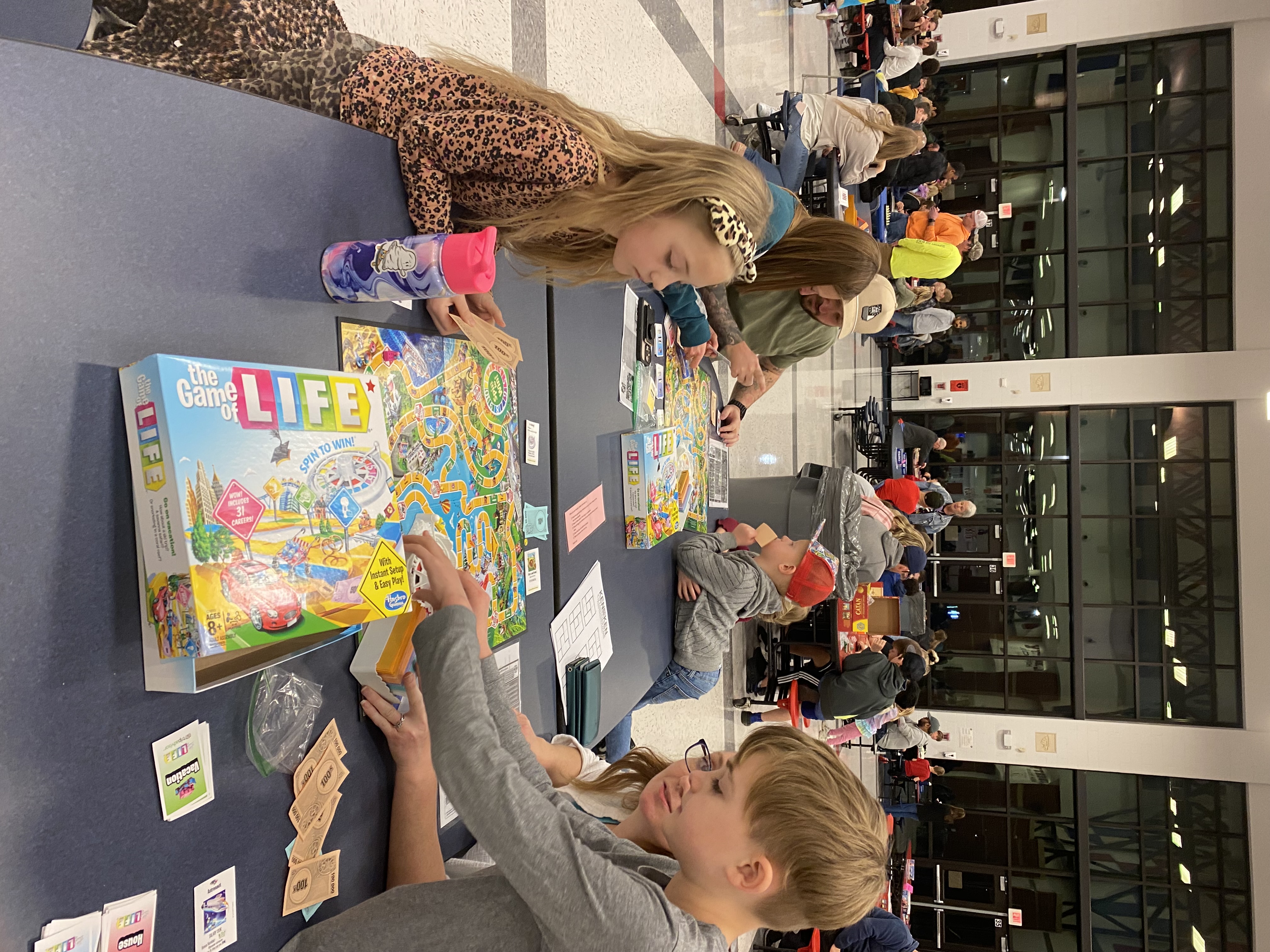 Family playing chess at the Horizons Family Night
